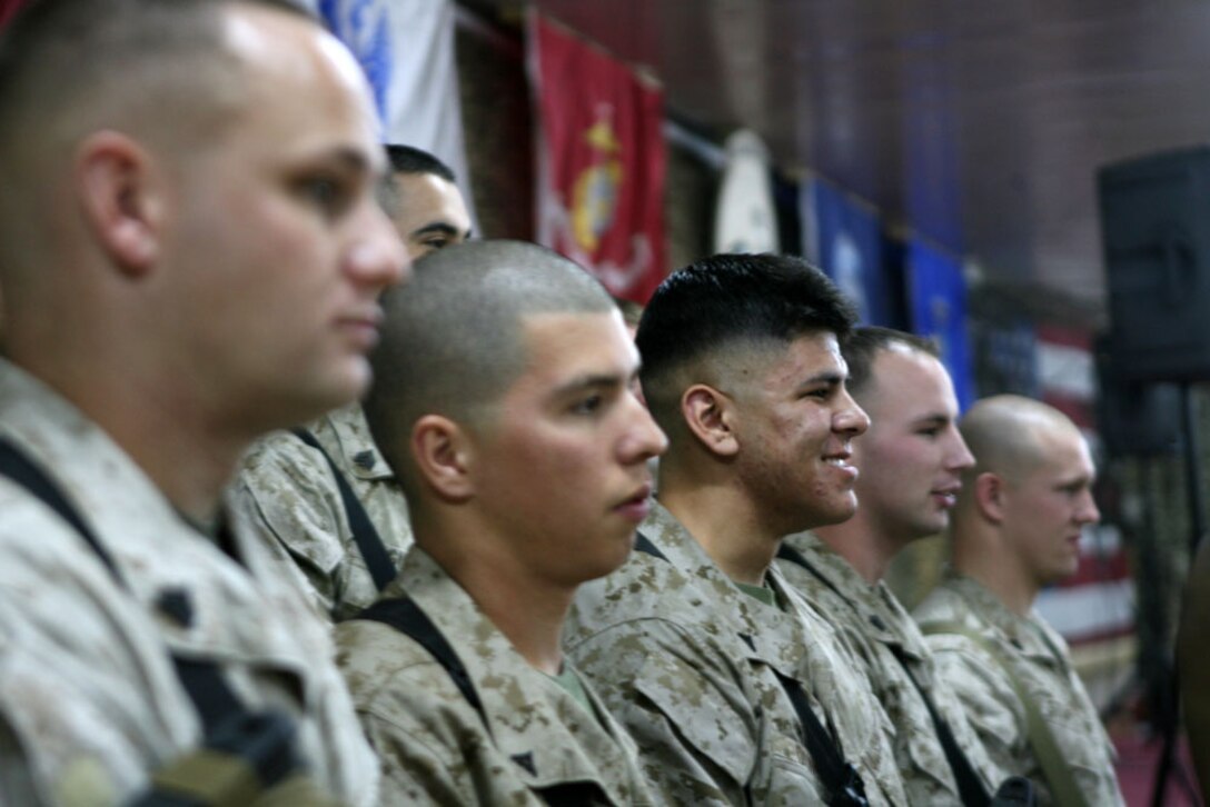 Lance Cpl. Michael S. Dunn (center), an administrative clerk with Regimental Combat Team 5, smiles while participating in Jimmy Kimmel Show via satellite Nov. 25 in Al Asad, Iraq. Two Marines from RCT-5 got to participate in the show, and both had the opportunity to speak to the people in attendance and give individual shout-outs to their families and hometowns. ::r::::n::