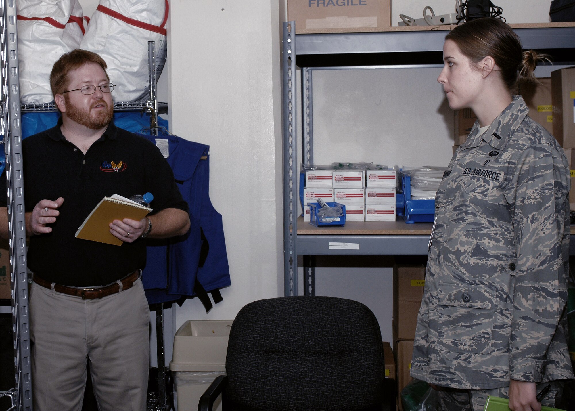 Dennis Ritko discusses safety procedures and how to improve them with 1st Lt. Carly Johnson. Mr. Ritko is a part of the Volunteer Protection Program team that visited Cannon Air Force Base, N.M, Nov. 3 to 7. The team was here to help improve current safety procedures at the base. Lieutenant Johnson is assigned to the 27th Special Operations Aerospace Medicine Squadron. (U.S. Air Force photo/Airman 1st Class James R. Bell)