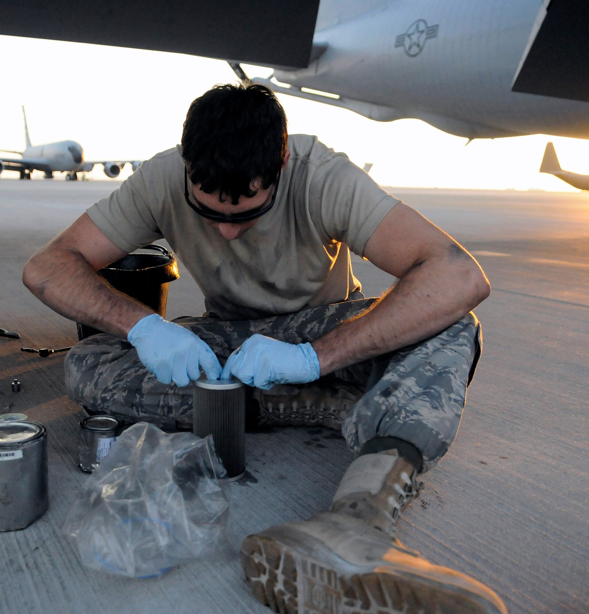 Airman 1st Class Alexander Lesch works a new seal into place on a fuel filter during a 120-hour inspection on a KC-135 Stratotanker engine Nov. 20 at an air base in Southwest Asia. KC-135s provide the core aerial refueling capability for the Air Force and support to Navy, Marine Corps and allied nation aircraft in the U.S. Central Command area of responsibility. Airman Lesch is a native of Burlington, Wis., and is deployed from Grand Forks Air Force Base, N.D. He is assigned to the 379th Expeditionary Aircraft Maintenance Squadron. (U.S. Air Force photo/Tech. Sgt. Michael Boquette) 
