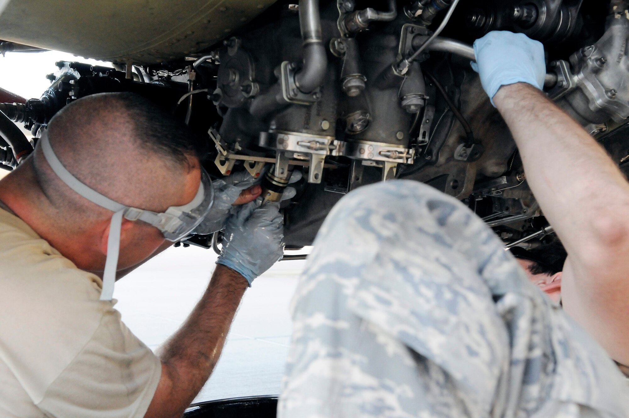Staff Sgt. Eric Mutschlechner replaces an engine magnetic chip during a 60-hour inspection on a KC-135 Stratotanker engine Nov. 20 at an air base in Southwest Asia. KC-135s provide the core aerial refueling capability for the Air Force and support to Navy, Marine Corps and allied nation aircraft in the U.S. Central Command area of responsibility. Sergeant Mutschlechner is a native of San Marcos, Texas, and is deployed from MacDill Air Force Base, Fla. He is assigned to the 379th Expeditionary Aircraft Maintenance Squadron. (U.S. Air Force photo/Tech. Sgt. Michael Boquette) 
