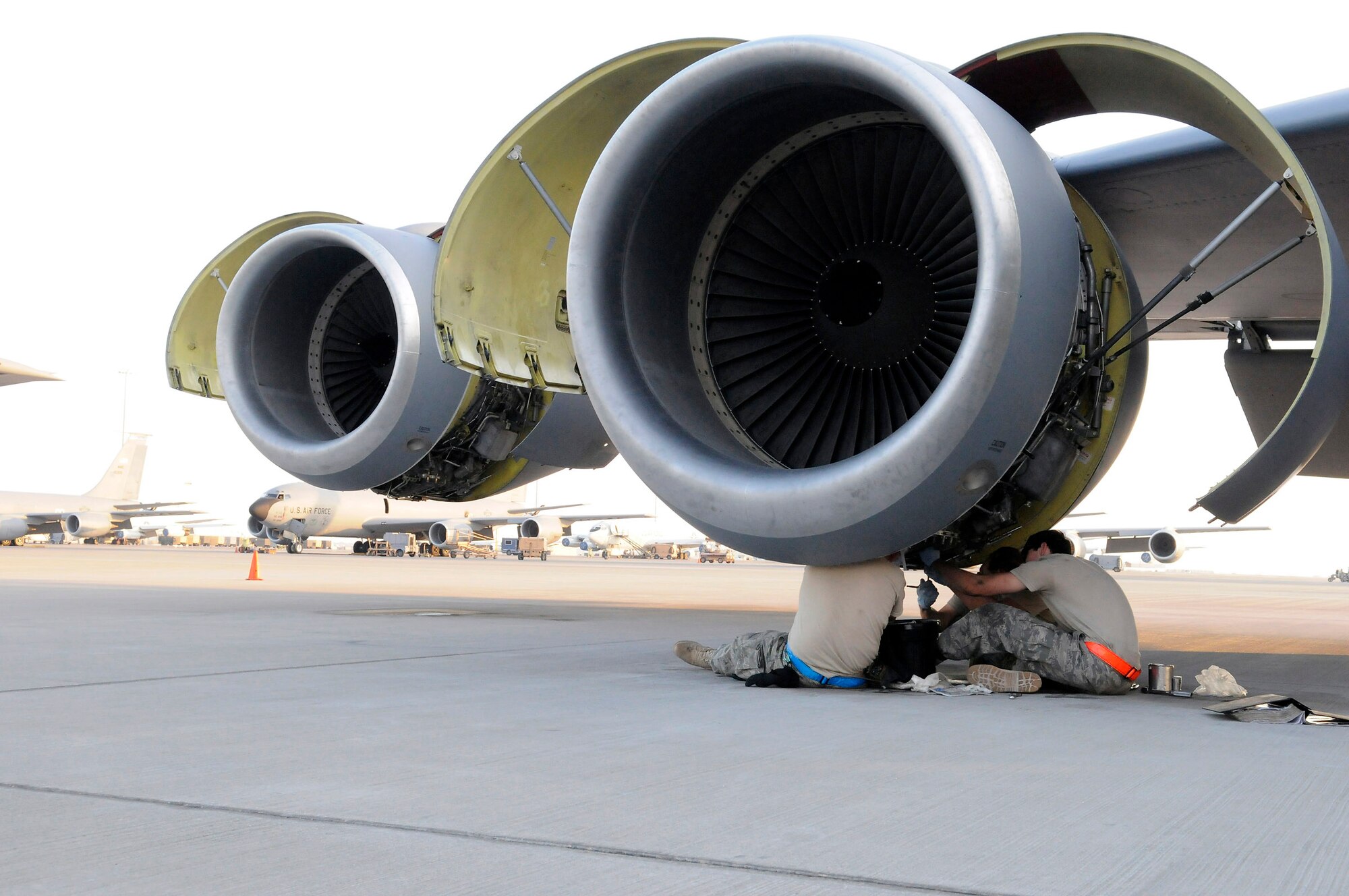 Staff Sgt. Eric Mutschlechner performs a 60-hour inspection as Staff Sgt. Anthony Hernandez and Airman 1st Class Alexander Lesch perform a 120-hour inspection on a KC-135 Stratotanker engine Nov. 20 at an air base in Southwest Asia. KC-135s provide the core aerial refueling capability for the Air Force and support to Navy, Marine Corps and allied nation aircraft in the U.S. Central Command area of responsibility. Sergeant Mutschlechner is a native of San Marcos, Texas, and is deployed from MacDill Air Force Base, Fla. Sergeant Hernandez hails from Barstow, Calif., and is deployed from McConnell AFB, Kan. Airman Lesch is from Burlington, Wis., and deployed from Grand Forks AFB, N.D. All three are assigned to the 379th Expeditionary Aircraft Maintenance Squadron. (U.S. Air Force photo/Tech. Sgt. Michael Boquette) 
