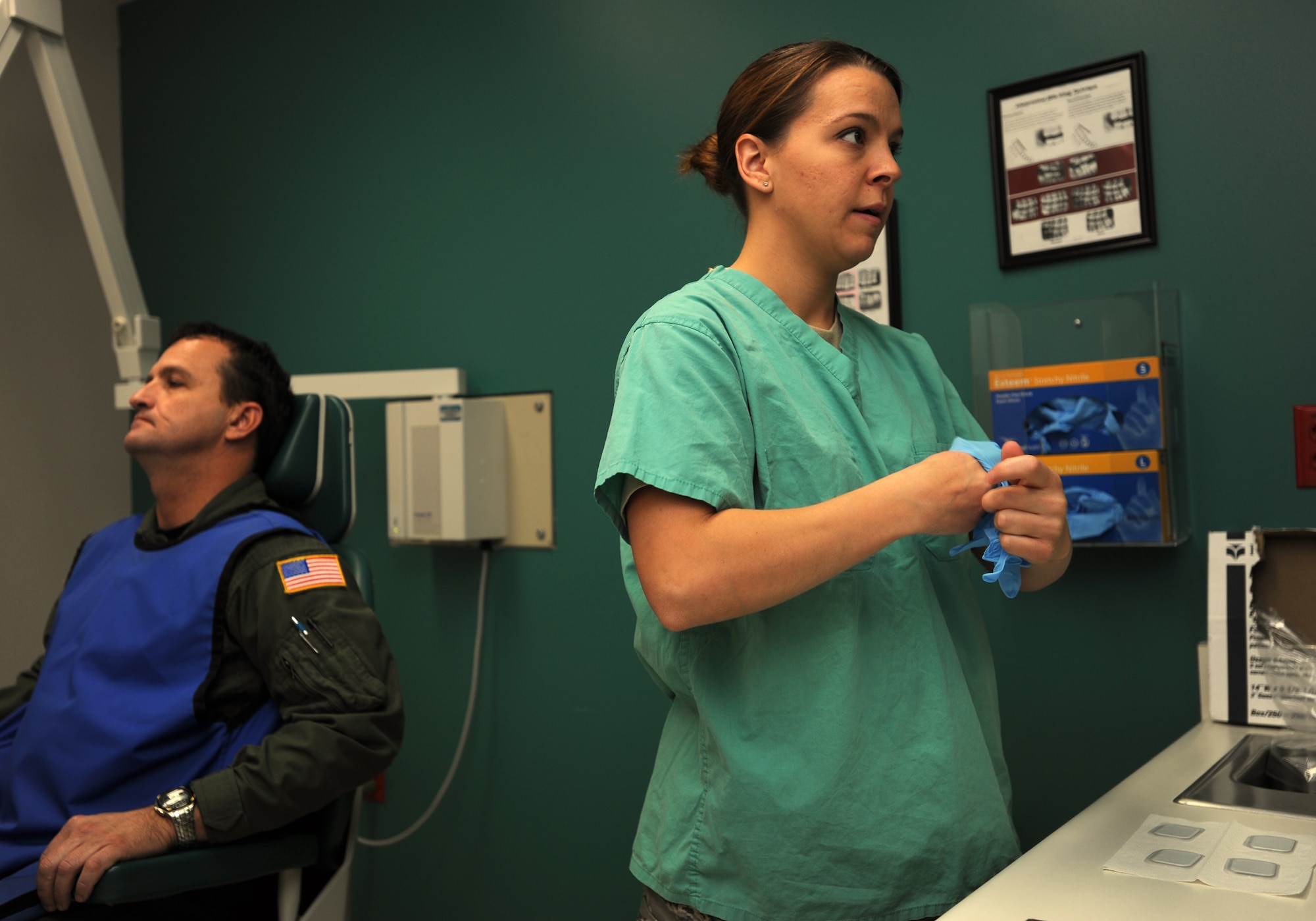 Staff Sgt. Andrea Robinson prepares to X-ray Master Sgt. Brad Beyer's teeth during the 931st Air Refueling Group's unit training assembly in November. Sergeant Robinson is a dental assistant assigned to the 931st Aerospace Medical Flight. Sergeant Beyer is a KC-135 Stratotanker boom operator assigned to the 18th Air Refueling Squadron, the flying squadron of the 931st ARG. (U.S. Air Force photo/Tech. Sgt. Jason Schaap) 