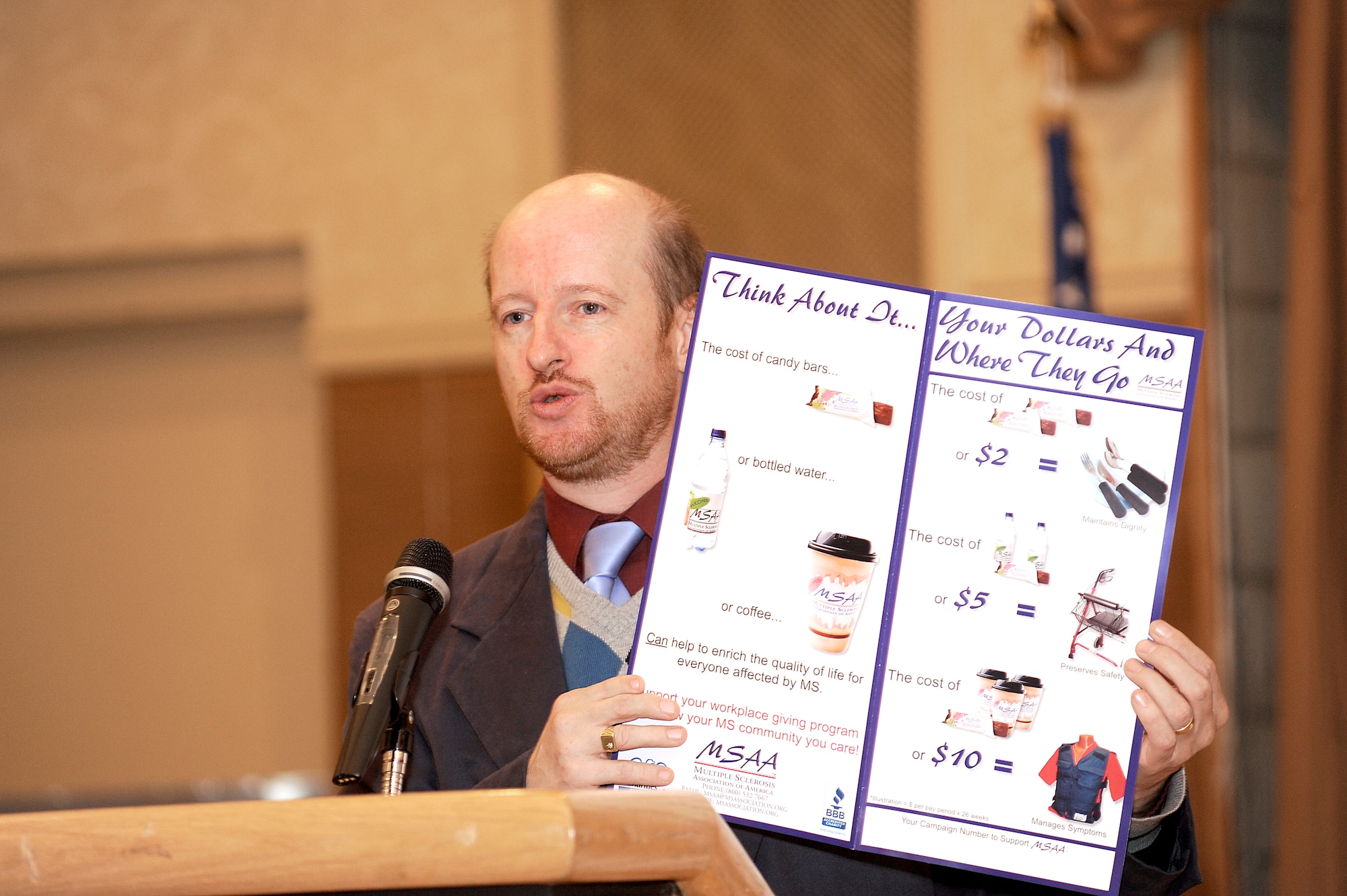 Malcolm Friend, director of Volunteer Services for the Multiple Sclerosis Association of America, displays a chart showing how Combined Federal Campaign donations can be put to use for those with MS during the CFC closing ceremony Nov. 25 at Club Dix. CFC pledges made by federal civilian, postal and military donors support eligible non-profit organizations that provide health and human service benefits throughout the world. Last-minute donations will be accepted through Dec. 15. For more information, contact your squadron representative or call Capt. Christopher Percy at (609) 754-3567. (U.S. Air Force photo/Carlos Cintron)