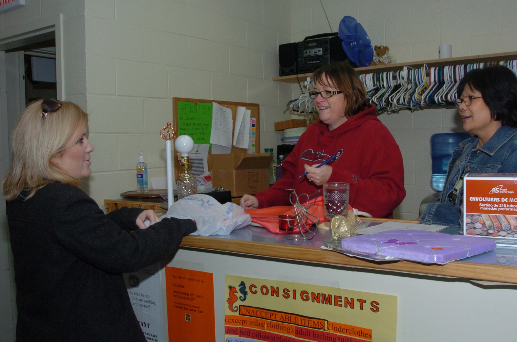 Mrs. Shelly Slate (left) managed the Altus Air Force Base Thrift Shop for a year but is preparing to relocate. Mrs. Slate, along with all of the thrift shop staff, are volunteers and profits from the store support an educational scholarship program. “Volunteering gives me a chance to step out of my own world, my own drama,” she said. Volunteers Linda Eger (center) and Merlie Biggs chat with Mrs. Slate. (U.S. Air Force photo/Master Sgt. Paul Dean)
