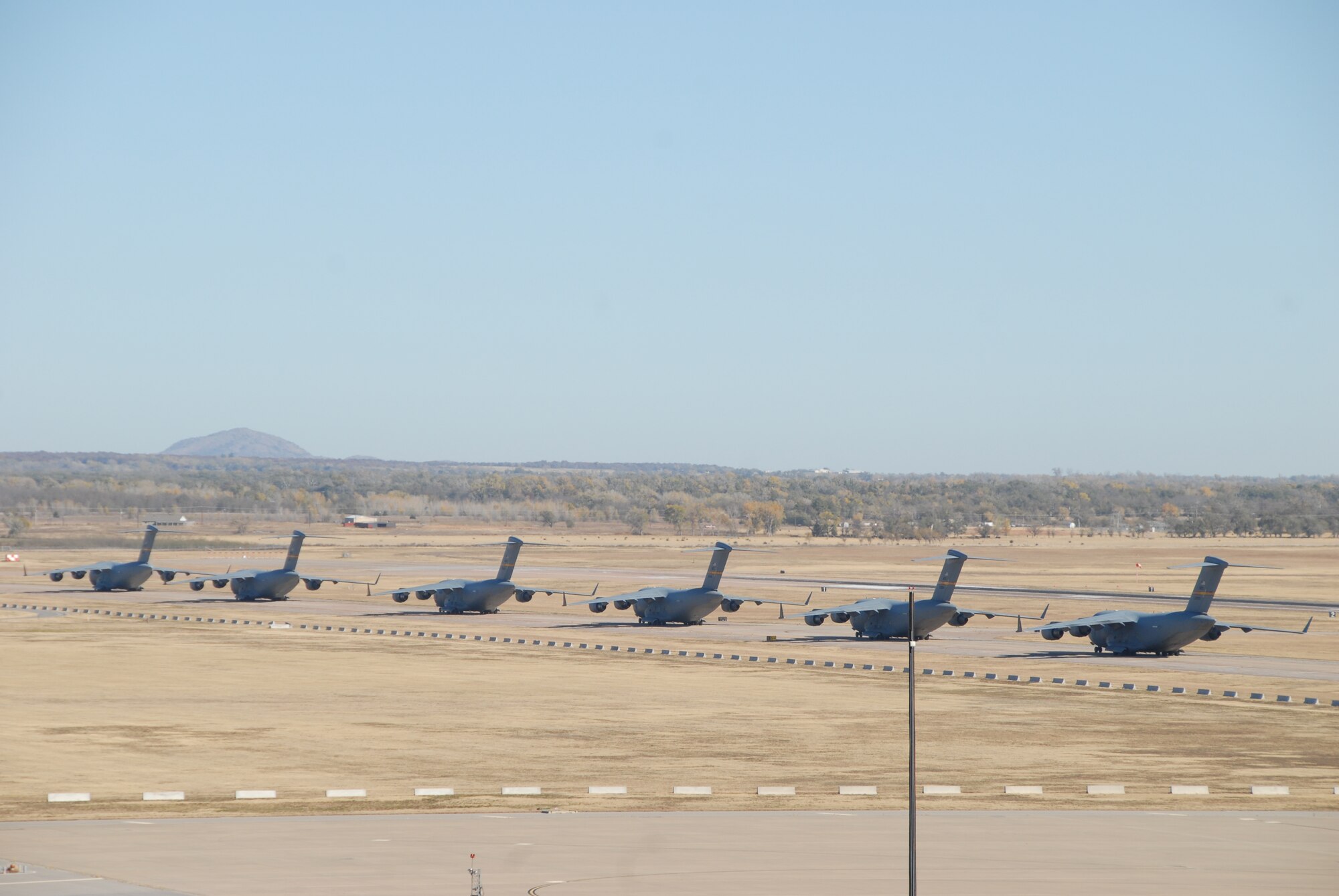 Six C-17 Globemasters take off in rapid succession as part of the Mobility Air Forces Exercise Nov. 19 (U.S. Air Force photo/Airman 1st Class Marianne E. Lane)