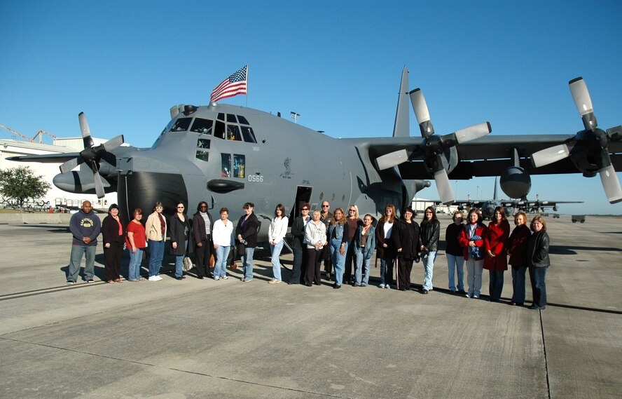 Spouses of 919th Special Operations Wing reservists gather for a group photo prior to a flight at the end of their tour on Duke Field. (U.S. Air Force Photo/Senior Airman Jon McCallum)