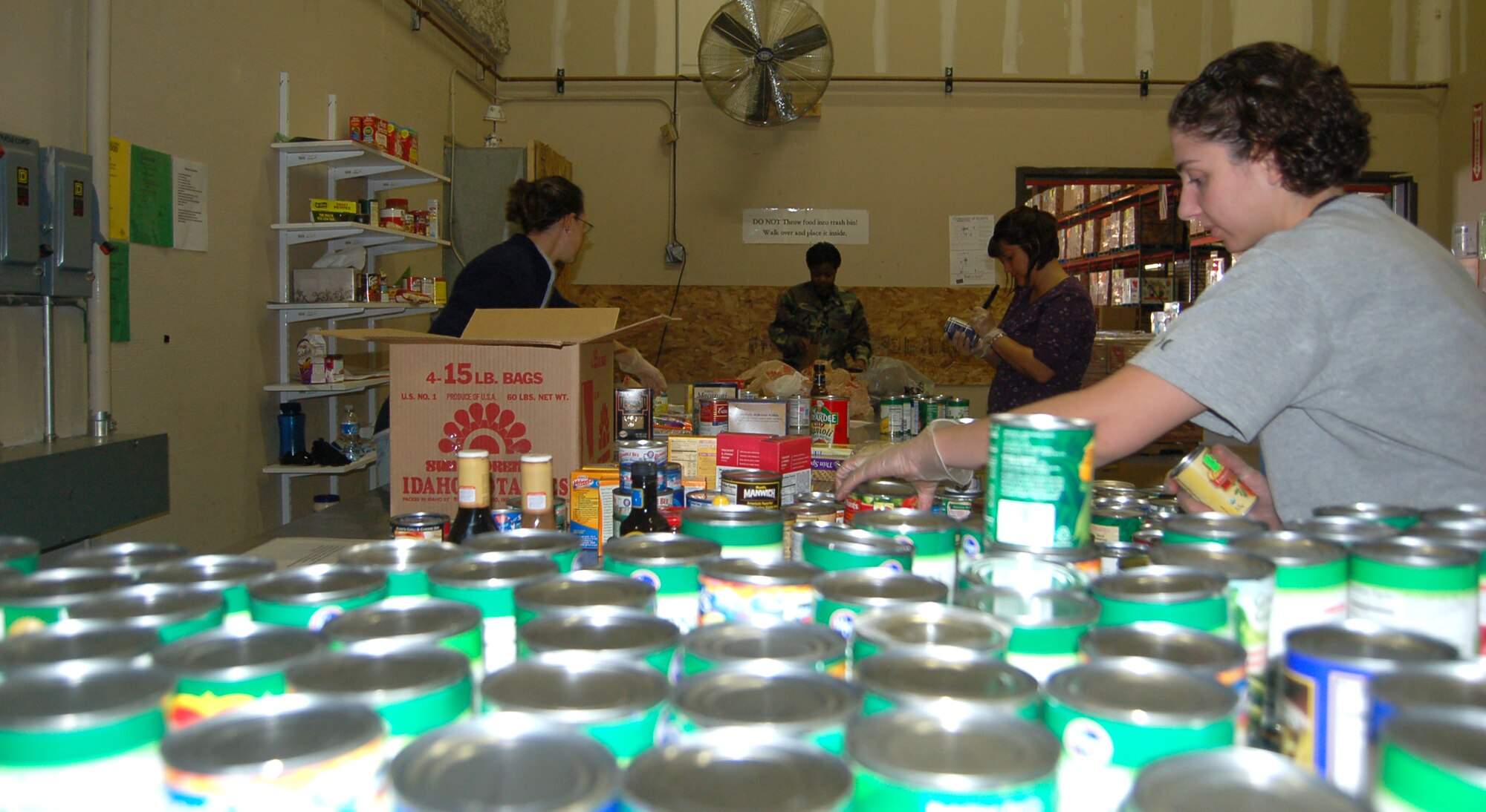 Peterson Airmen sort and pack boxes of food for Care and Share’s Harvest of Love food drive. More than 125 Airmen volunteered to help with the drive this year, unloading, sorting and packaging more than 100,000 pounds of food destined for food banks throughout southern Colorado. (Air Force photo)