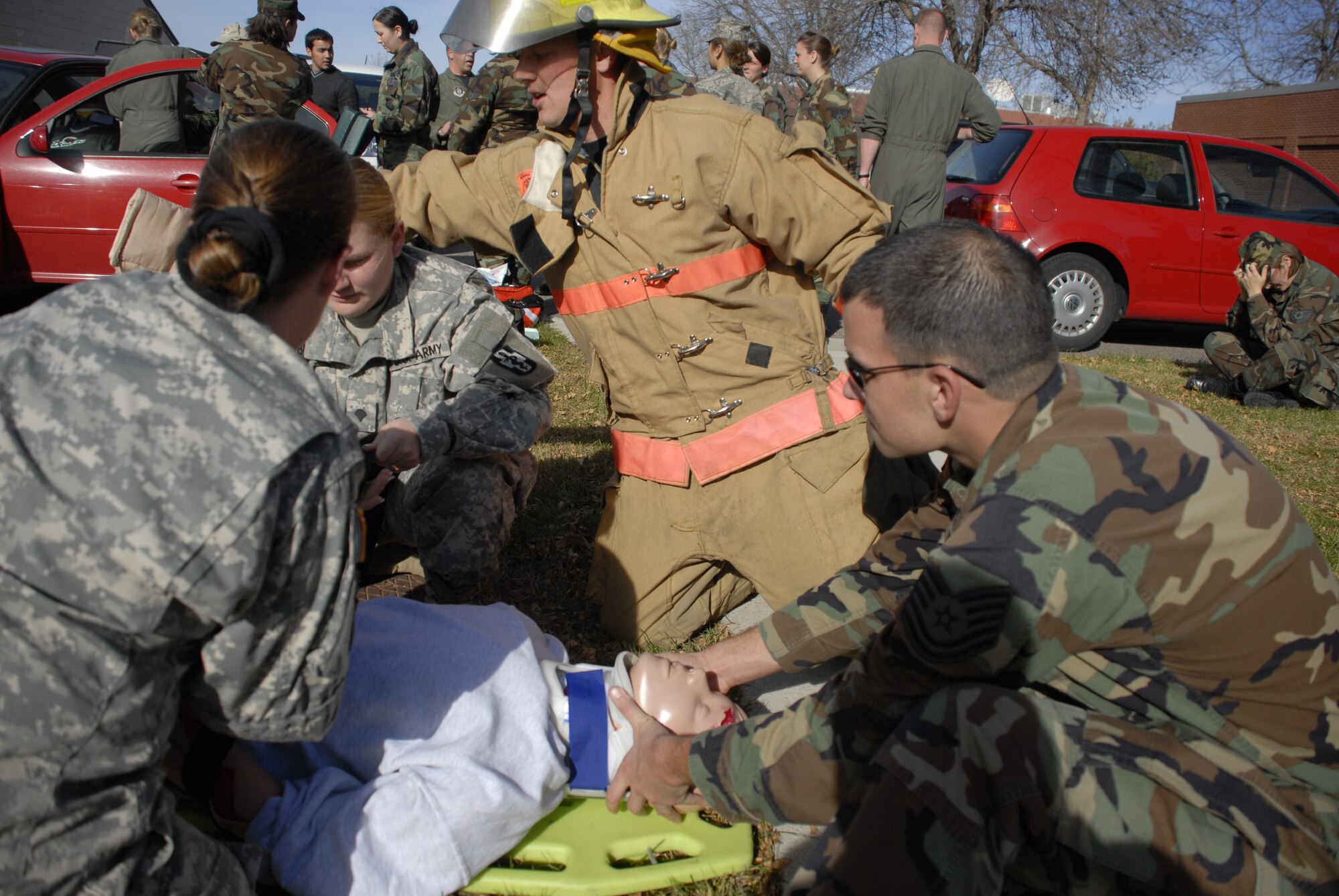 Army and Air Force first responders arrive at an "accident" as part of a joint-service three-day emergency medical technician refresher training here Oct. 31. the medics, from local reserve and National Guard units, are required to complete the recertification every two years. Training is provided free of charge and saves the units thousands of dollars annually. (Air Force photo/Master Sgt. Paul Zadach)