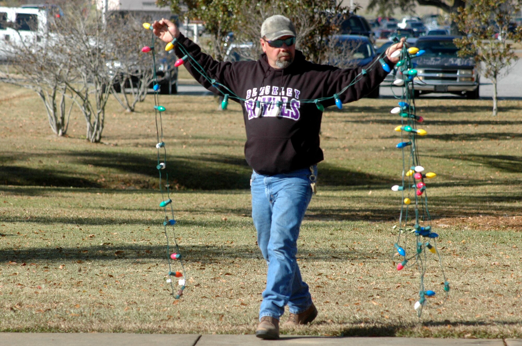 Donnie Evans, 78th CES exterior electric shop, lines up strings of lights to be placed on the chapel tree. U. S. Air Force photo by Sue Sapp
