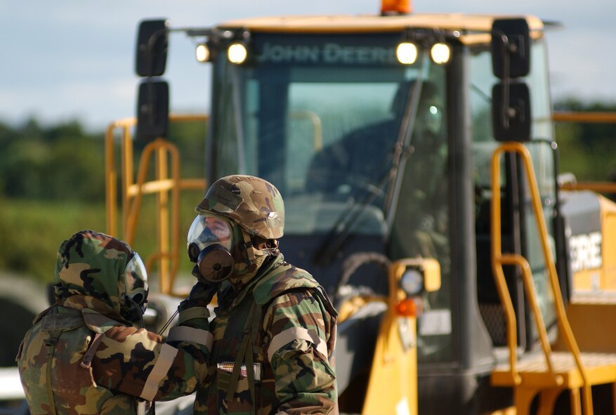 Airmen conduct buddy checks after donning their gas masks Nov. 24, 2008. During the week-long Silver Flag, Airmen train for a week how to open, establish and sustain a forward operating base before they deploy to real-world operations.  (U.S. Air Force photo/Tech. Sgt. Rey Ramon)      