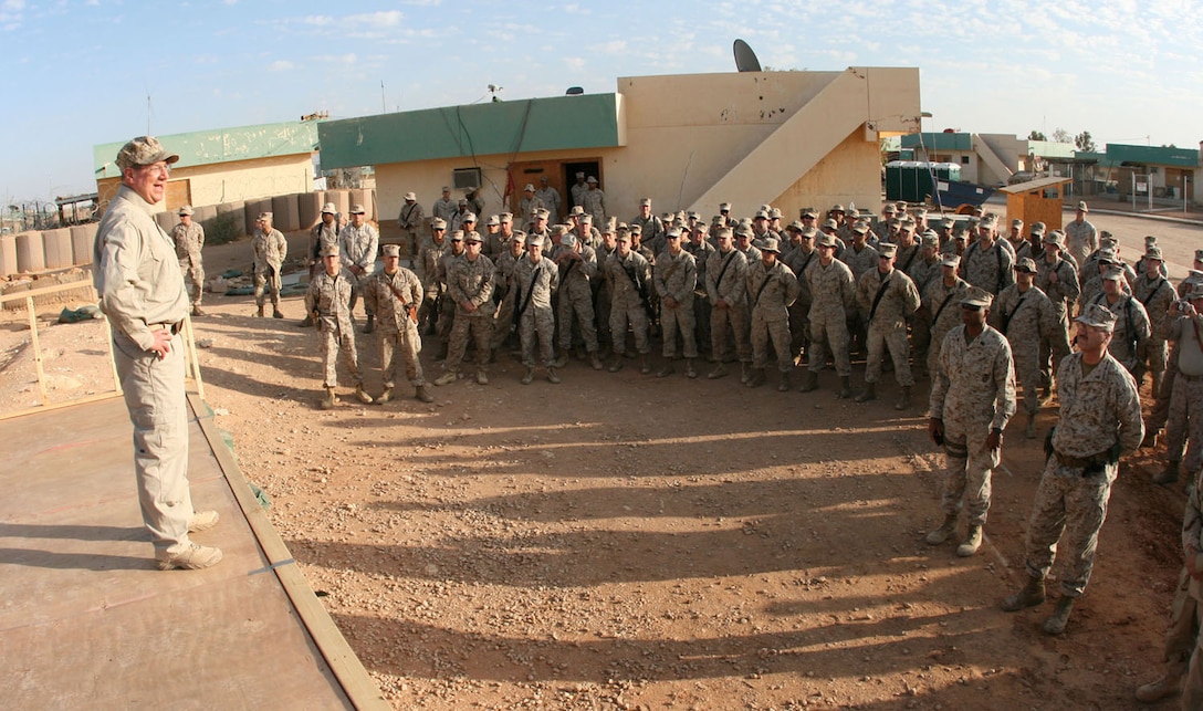 The Honorable Donald C. Winter, secretary of the Navy, addresses a formation of soldiers, sailors and Marines during his visit to Camp Korean Village, Iraq, Nov. 26.  Based at the Pentagon in Washington, D.C., Mr. Winter is one of the most senior officials in the Marines and sailors' chain of command.  ::r::::n::