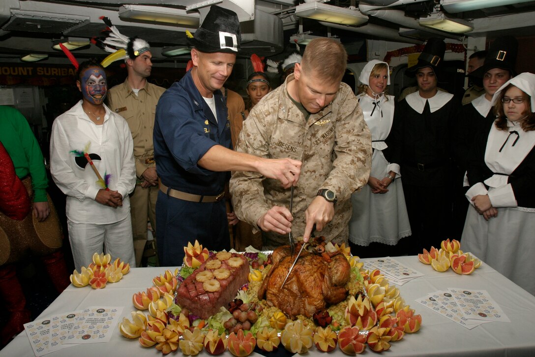 ARABIAN GULF (Nov. 27, 2008) - Captain Robert Irelan and Colonel Mark J. Desens carve the Thanksgiving turkey aboard USS Iwo Jima (LHD-7), Nov. 27, 2008. The turkey is to be served for the Thanksgiving dinner for Marines and sailors aboard the Iwo Jima. The 26th Marine Expeditionary Unit and Iwo Jima Strike Group are currently deployed to the 5th Fleet Area of Operation. (Official USMC photo by Cpl. Patrick M. Johnson-Campbell) (Released)