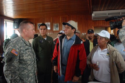 CHANGUINOLA, PANAMA-- President of Panama, Martin Torrijos, discusses planned rescue missions of flood victims cut off from food, water and medical attention, with Army Lt. Col. Richard Somers, disaster task force commander deployed here from Joint Task Force-Bravo Honduras. Eighteen service members from JTF-Bravo are here in support of a request from the Panamanian government for assistance with recent flooding caused by prolonged heavy rains in the country. (U.S. Air Force photo by 1st Lt. Candace Park)