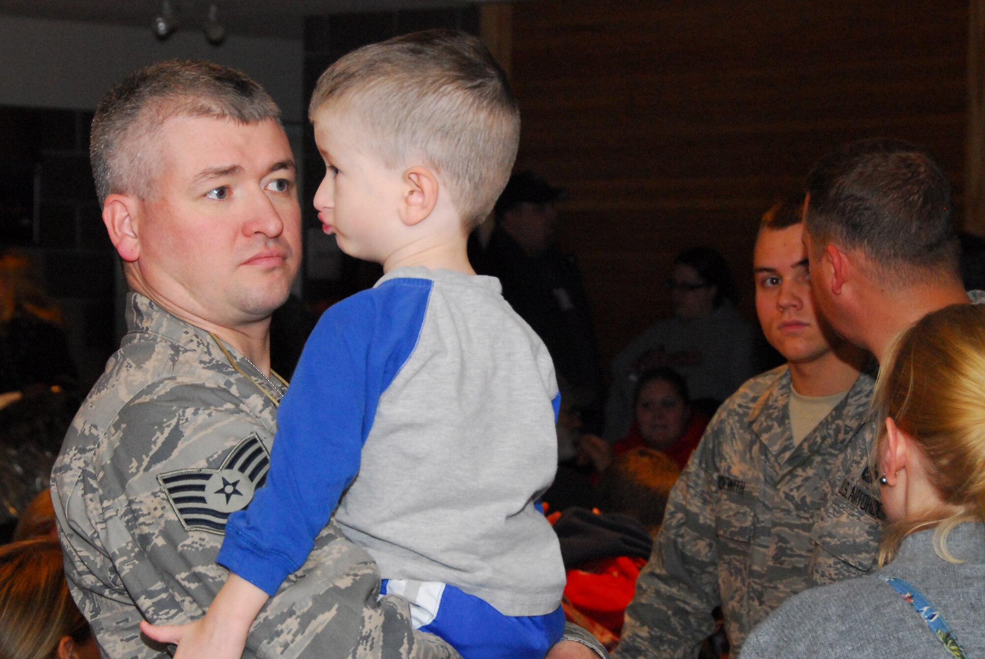 U.S. Air Force Tech. Sgt. Brad Johnson says goodbye to his son as he and approximately 125 members of the 148th Fighter Wing, Duluth Minn. deploy to Joint Base Balad, Iraq on November 27, 2008 as a part of its Air Expeditionary Force (AEF) deployment. (U.S. Air Force photo by TSgt Jason W. Rolfe) (Released)