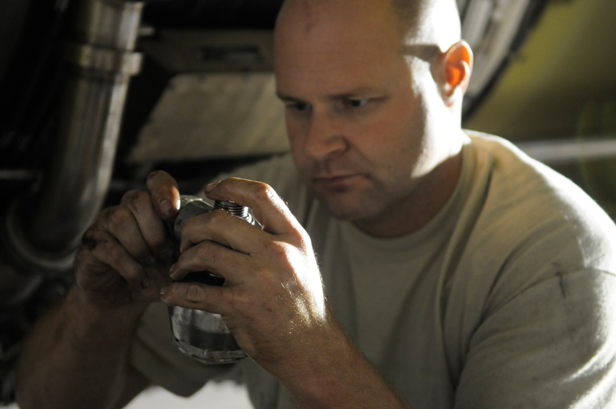 Tech. Sgt. Robert Prier, hydraulic craftsman assigned to the 379th Expeditionary Aircraft Maintenance Squadron, reattaches a hydraulic pump surge suppressor on a KC-135 Stratotanker engine, Nov. 26, at an undisclosed air base in Southwest Asia.  The KC-135 Stratotanker provides the core aerial refueling capability for the Air Force, Navy, Marine Corps and allied nation aircraft in the Central Command area of responsibility.  Sergeant Prier, a native of Pulaski, Tenn., is deployed from MacDill Air Force Base, Fla., in support of Operations Iraqi and Enduring Freedom and Joint Task Force-Horn of Africa.  (U.S. Air Force photo by Tech. Sgt. Michael Boquette/Released)