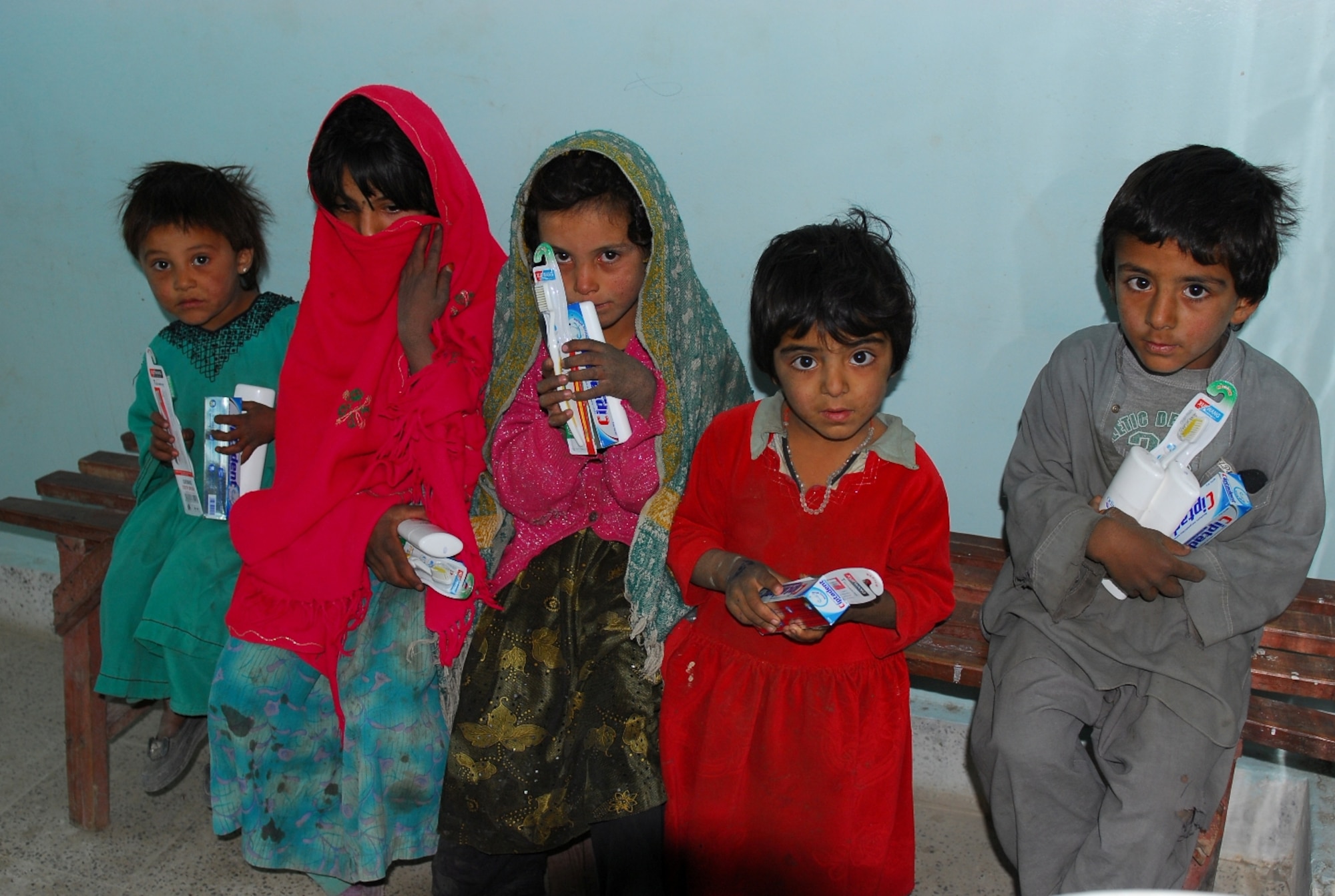 Paktia province, Afghanistan -- Afghan children received toothpaste and toothbrushes after being examined by Coalition medics during a Medical Civic Action Program in Dand Patan district Nov. 19.  Coalition medics treated more than 200 people during the event.  (Photo by Army Sgt. Lynne Eickstedt)
