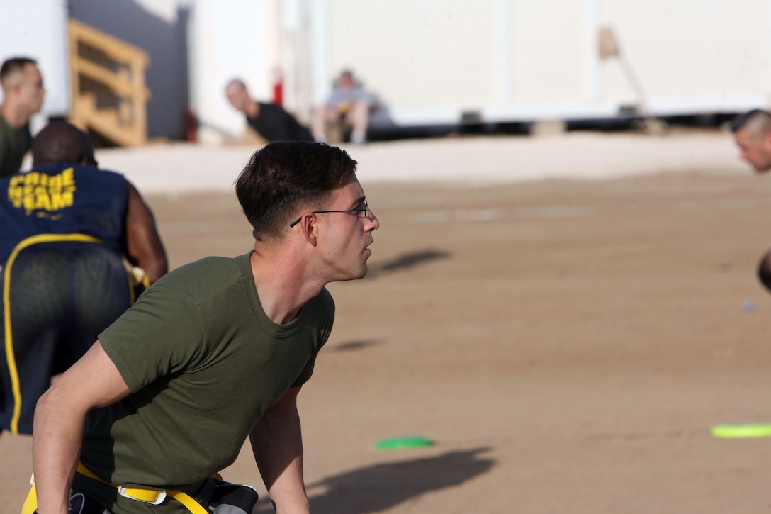 Cpl. Stephen McGinnis, a combat correspondent with Regimental Combat Team 1, prepares for a play during the 2008 Turkey Bowl Flag Football Tournament at Camp Ramadi, Iraq, Nov. 27. Marines of RCT-1, Team 2 outscored opponents 155-60 to win the tournament. (Official U.S. Marine Corps photo by Muhannad Faisal) (Released).