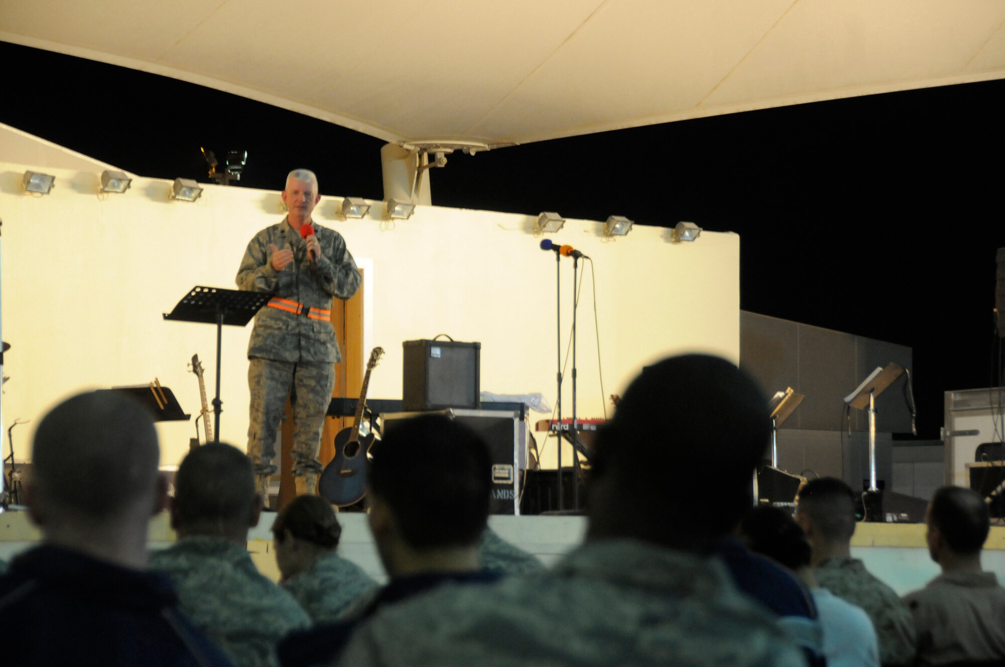 Chaplain Lt. Col. Ronald Harvell, 379th Air Expeditionary Wing, delivers a sermon from the scriptural reading of Luke during the Ecumenical Thanksgiving Service Nov. 27, at an undisclosed air base in Southwest Asia. The service was held for all deployed members during the Thanksgiving holiday as a way of reminding everyone all we have to be thankful of while away from family members. Colonel Harvell is deployed in support of Operations Iraqi and Enduring Freedom and Joint Task Force-Horn of Africa. (U.S. Air Force photo by Staff Sgt. Darnell T. Cannady/Released)