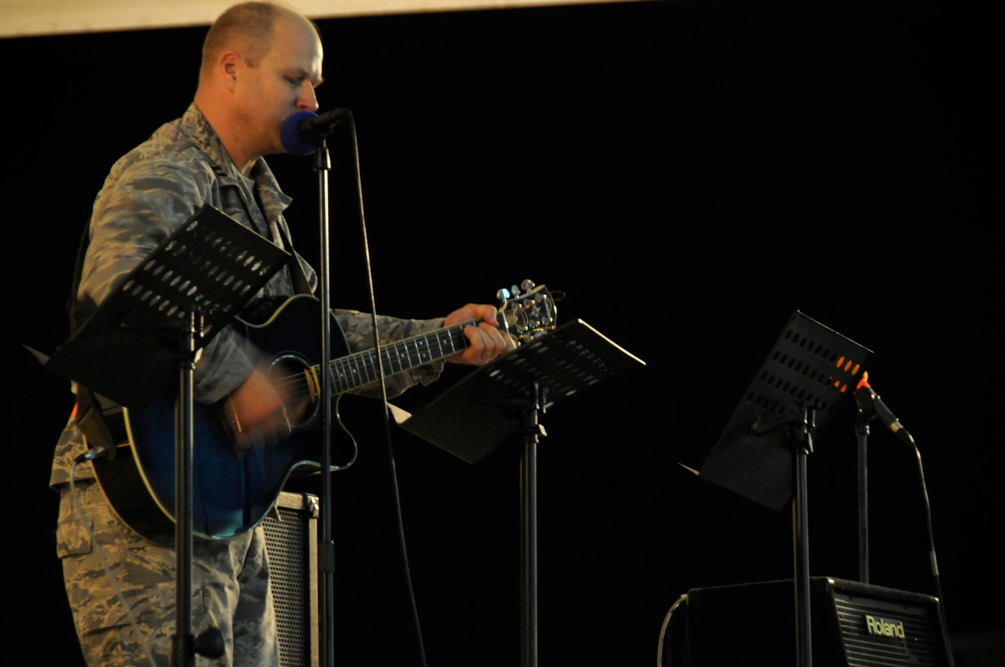 Captain Shannon Workman, 379th Air Expeditionary Wing, plays the hymn "Come Thou Fount of Every Blessing" during the Ecumenical Thanksgiving Service Nov. 27, at an undisclosed air base in Southwest Asia. The service was held for all deployed members during the Thanksgiving holiday as a way of reminding everyone all they have to be thankful of while away from family members. Captain Workman is deployed in support of Operations Iraqi and Enduring Freedom and Joint Task Force-Horn of Africa. (U.S. Air Force photo by Staff Sgt. Darnell T. Cannady/Released)