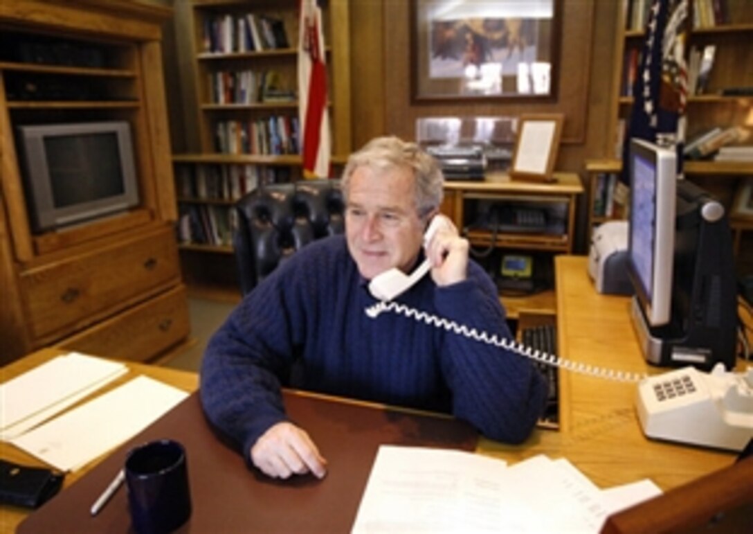 President George W. Bush talks to military personnel from Camp David, Md., Thanksgiving Day, Nov. 27, 2008. The president called members of the Armed Forces stationed in remote locations worldwide to wish them a happy Thanksgiving and thank them for their service to our nation. 