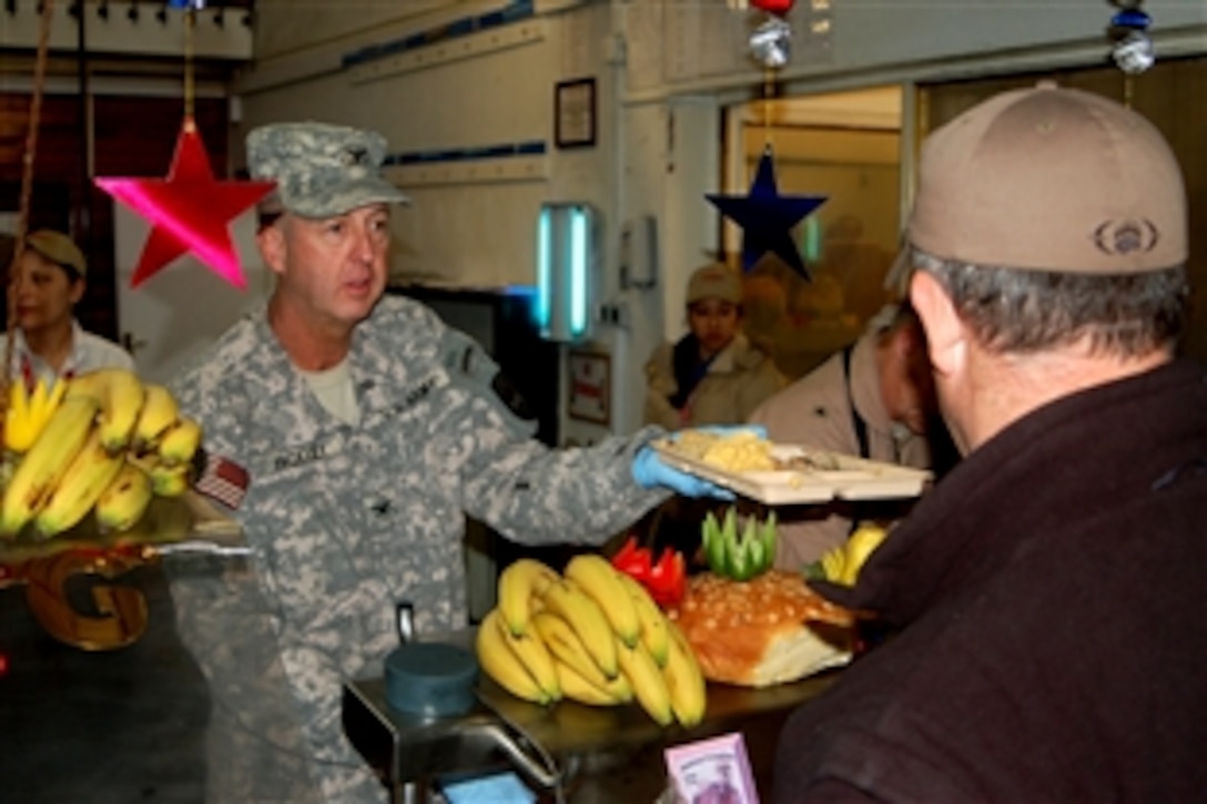 U.S. Army Col. Stephen G. Yackley helps dish out Thanksgiving dinner, Nov. 27, 2008, to the servicemembers of Camp Eggers, Kabul, Afghanistan. Yackley is deputy to the commanding general, Police Development, Combined Security Transition Command-Afghanistan.