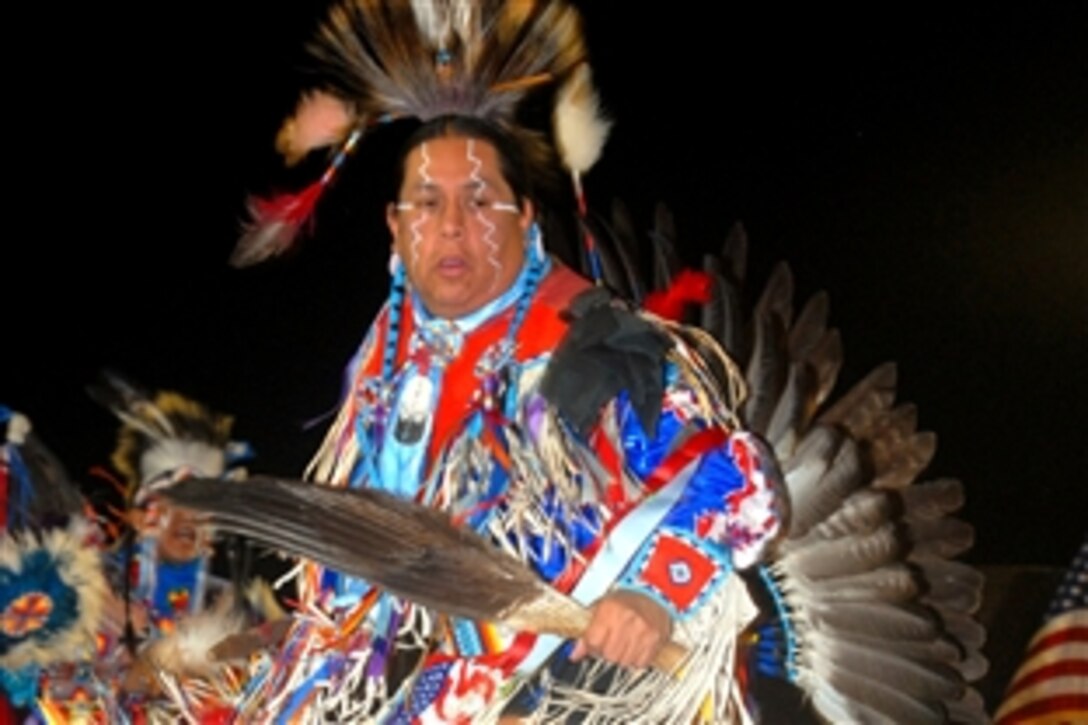 Edmund Nevaquaya, a member of the Kevin Locke Native Dance Ensemble, performs a traditional male Native American dance during a performance, Nov. 25, 2008, at the Victory Stage, Camp Victory, Iraq.
 


