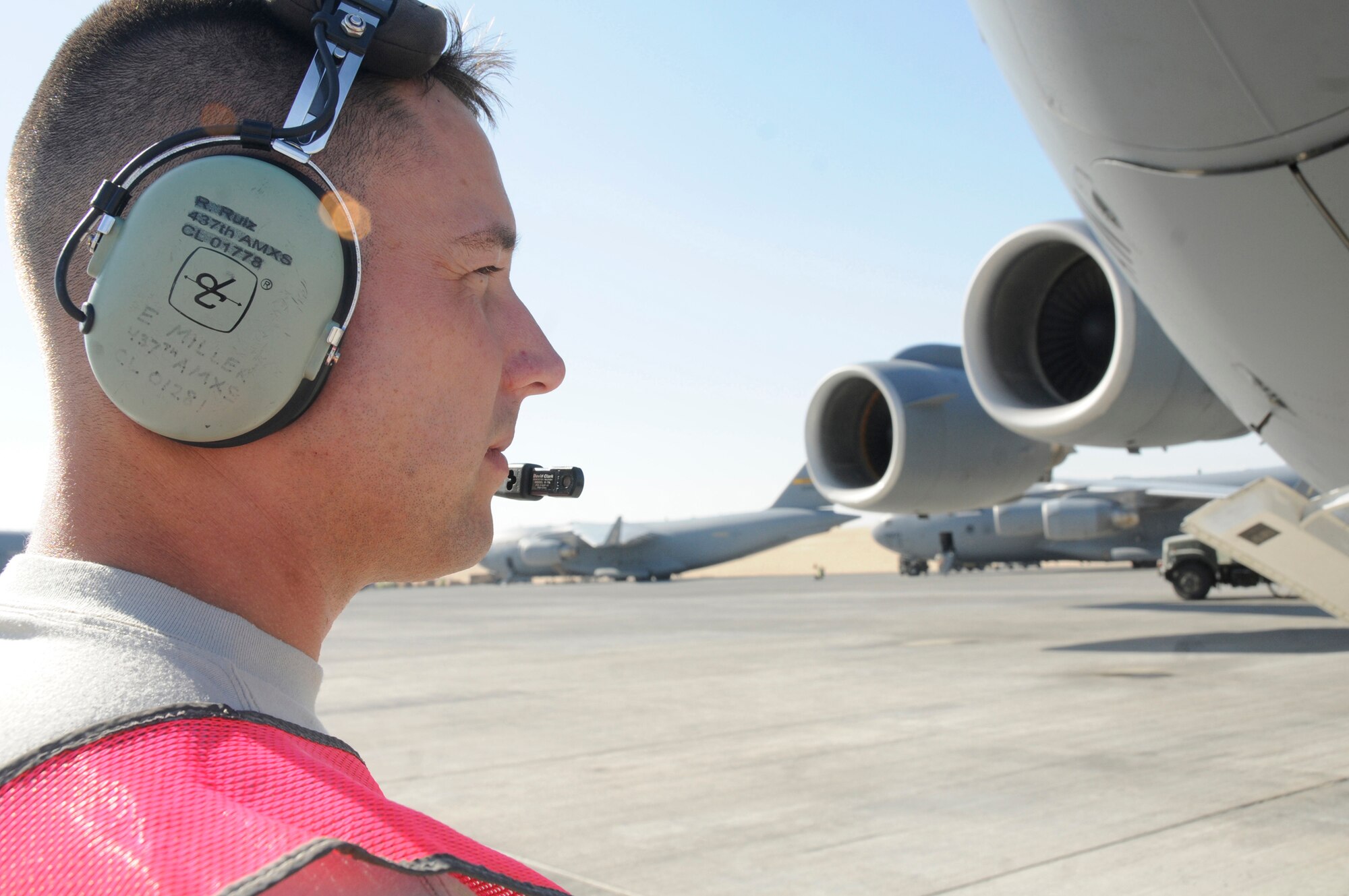 Senior Airman Eric Miller, communications technician assigned to the 8th Expeditionary Air Mobility Squadron, performs a pre-flight inspection of a C-17, Nov. 19, 2008, at an undisclosed air base in Southwest Asia. The 8 EAMS member is responsible for ensuring the C-17 is capable of flying and carrying out its mission. Airman Miller, a native of Chicago, Ill., is deployed from Charleston Air Force Base, S.C., in support of Operations Iraqi and Enduring Freedom and Joint Task Force-Horn of Africa. (U.S. Air Force photo by Staff Sgt. Darnell T. Cannady/Released)