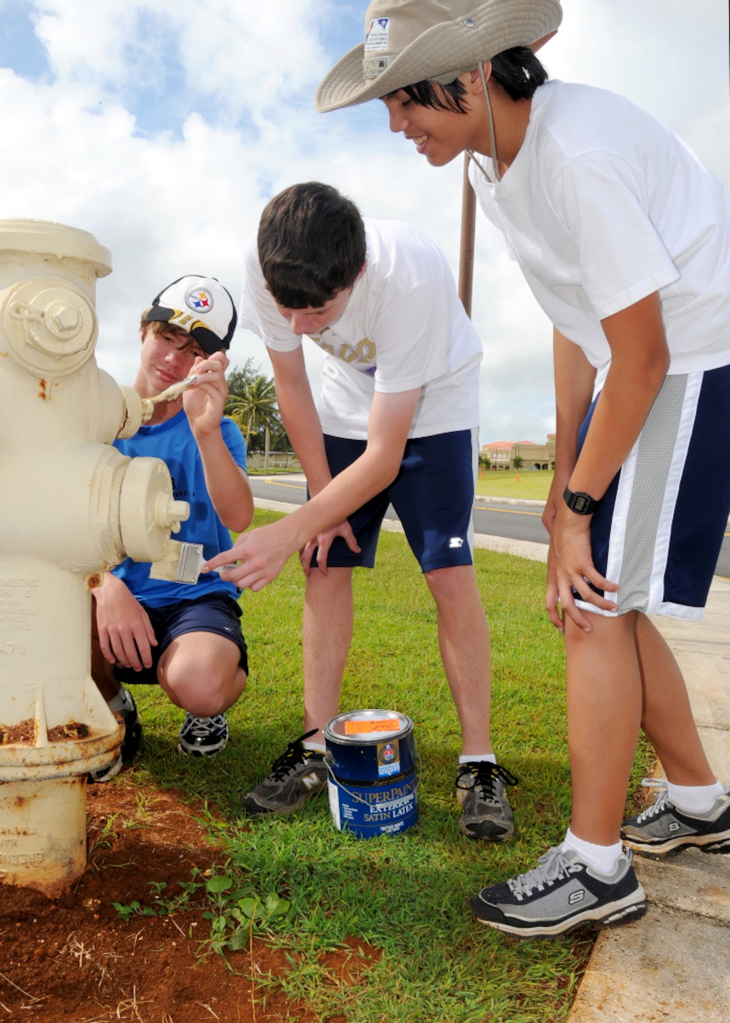 ANDERSEN AIR FORCE BASE, Guam - Members of Andersen's Troop 20 paint fire hydrants around the base Nov. 22. The boy scout troop, non-exclusive to Andersen is made up of 10 young men. The troop participates in various activities that help improve Andersen such as conducting quarterly cleanup of the “Ole 100” display and  the monthly beach clean up. (U.S. Air Force photo by Senior Airman Nichelle Griffiths)