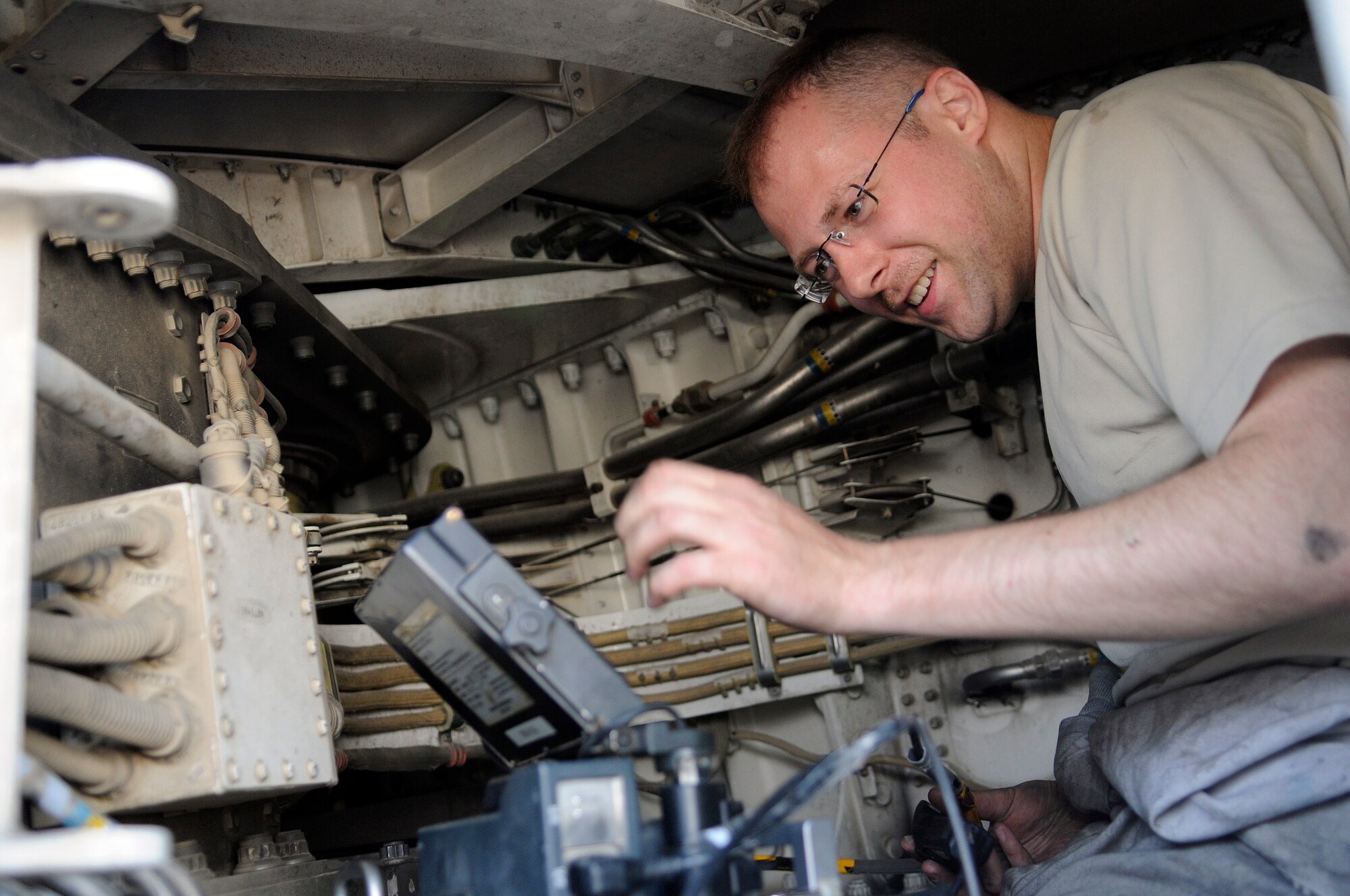 Staff Sgt. Craig Hadrych, non-destructive inspection craftsman assigned to the 379th Expeditionary Maintenance Squadron, powers up a borescope in a wing carry through area of a B-1B Lancer, Nov. 29, at an undisclosed air base in Southwest Asia.  The borescope is used to check the wing carry through lower pivot lug.  The B-1 is the backbone of America's long-range bomber force. It can rapidly deliver massive quantities of precision and non-precision weapons against any adversary, anywhere in the Central Command area of responsibility.  Sergeant Hadrych hails from Eden, N.Y., and is deployed from Royal Air Force Mildenhall, England, in support of Operations Iraqi and Enduring Freedom and Joint Task Force-Horn of Africa.  (U.S. Air Force photo by Tech. Sgt. Michael Boquette/Released)