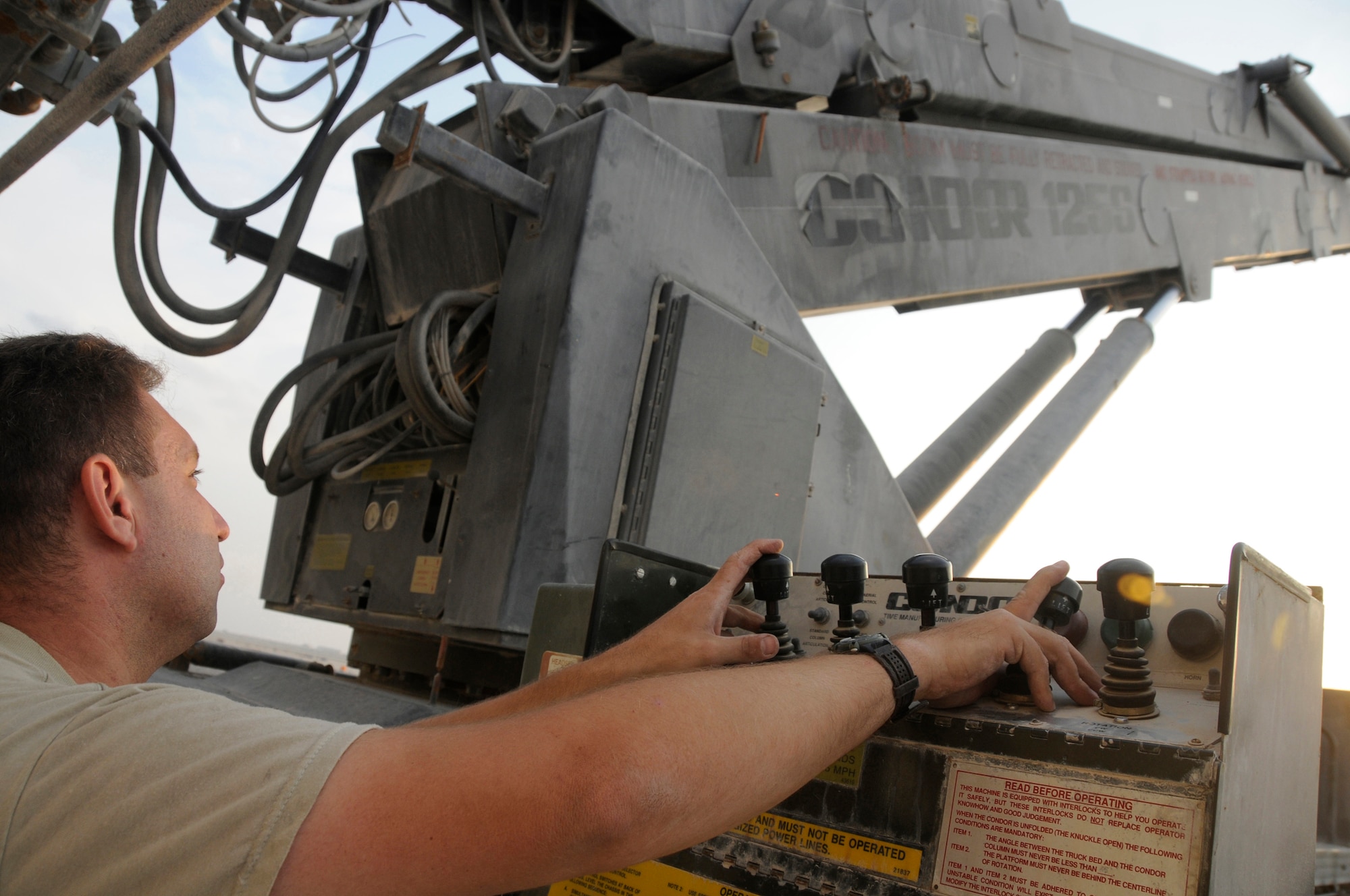 Staff Sgt. Kevin Stasik, C-17 crew chief assigned to the 8th Expeditionary Air Mobility Squadron, operates the condor to stow it and prepare for movement Nov. 28, at an undisclosed air base in Southwest Asia. Sergeant Stasik, a native of Fort Lauderdale, Fla., is deployed from Charleston Air Force Base, S.C., in support of Operations Iraqi and Enduring Freedom and Joint Task Force-Horn of Africa. (U.S. Air Force photo by Staff Sgt. Darnell T. Cannady/Released)