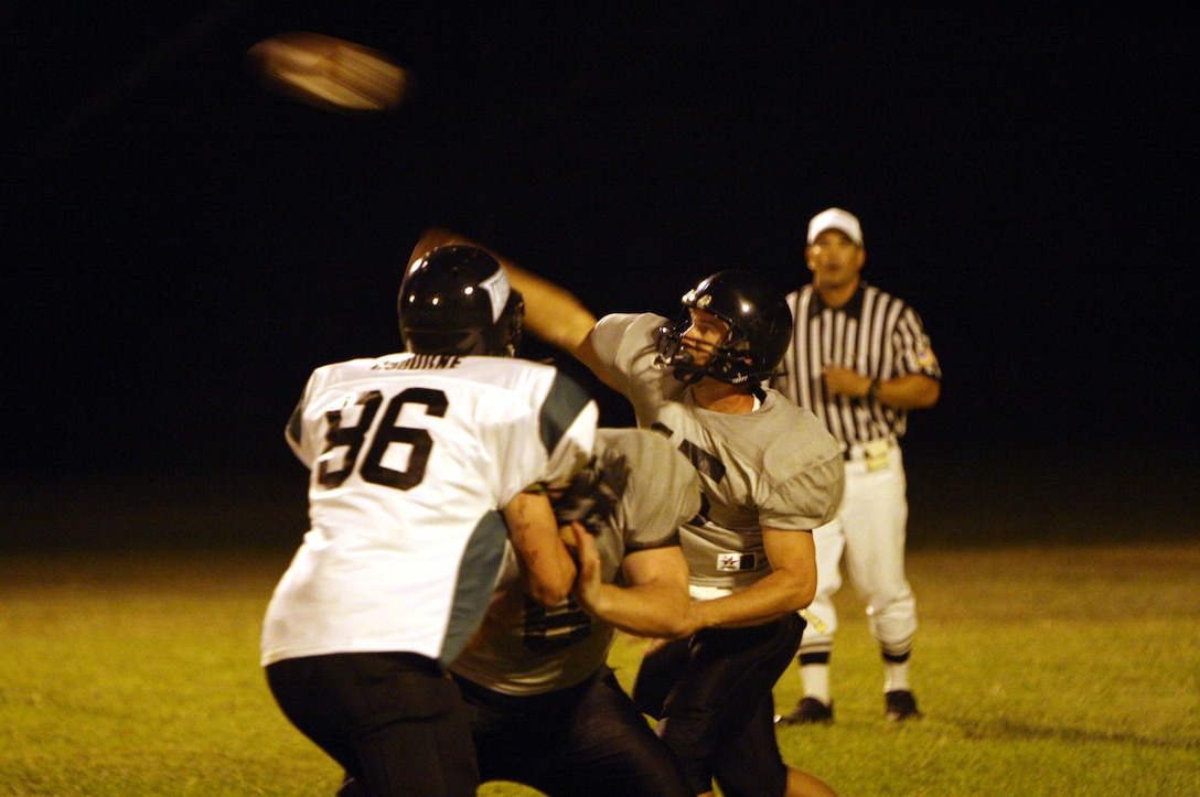 Jason Davis, Camp Smith Raiders quarterback, releases a hail mary pass under pressure during a 2008 Intramural Football League game at Bordelon Field Oct. 1.