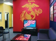 The wall colors of the new recruiting office design reflects that of the Marine dress blue uniform. JWT, the Marine Corps’ advertising firm, has worked to create a new, uniformed interior design for the offices consistent with the image created for the Corps’ Web, print and television campaigns.