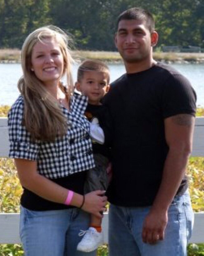 Sgts. Kara and Victor Perez enjoy a day at a fall festival in Kansas City with their son Roman in October, 2008.