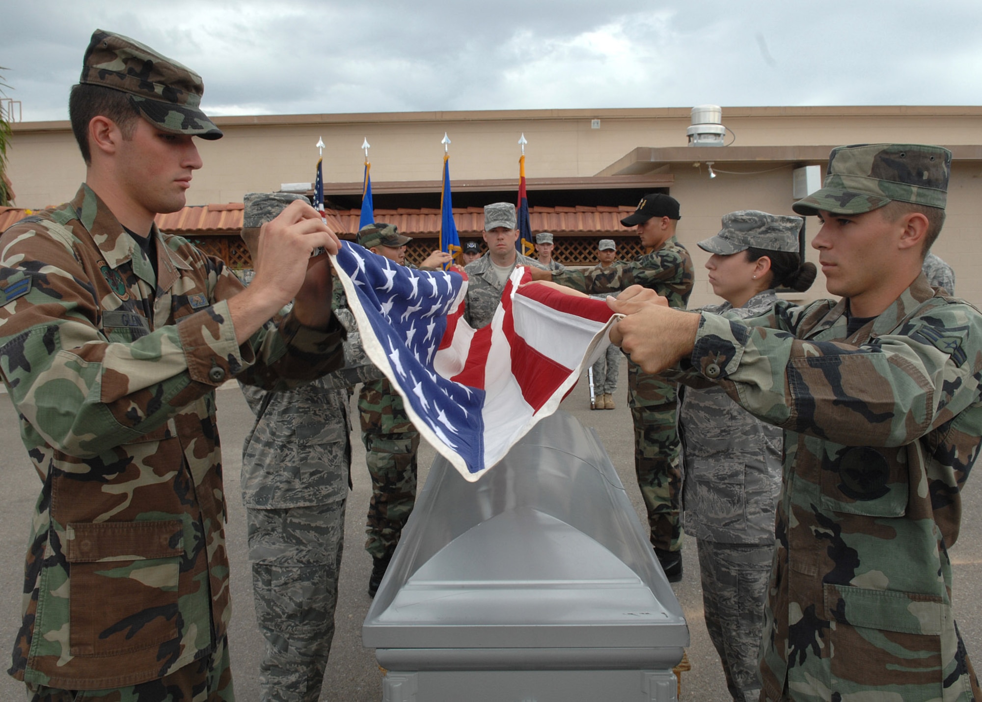 Davis-Monthan Air Force Base’s Honor Guard performs the flag fold over a casket during a mock funeral here on Sept. 28, 2008.  The D-M team has been taught by the Air Forces Honor Guardsmen making sure D-M has the finest they can get.  The D-M was taught colors, rifles, and funerals.  (US Air Force Photo By: Senior Airman Jacqueline Romero)