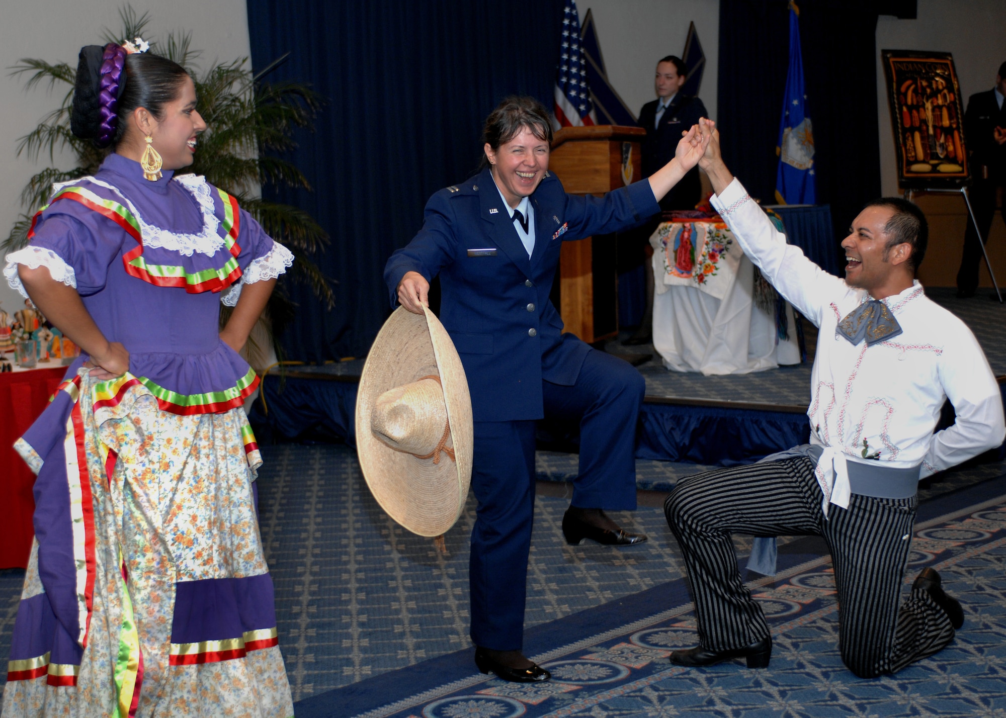 Chaplain Olga Westfall, 49th Fighter Wing Chapel, dances with a member of the Ballet Folklorico Quetzales during the Hispanic Heritage Luncheon, at Holloman Air Force Base, N.M., September 25. Before the dancers left the dance floor,  guests were invited to join them for one last dance. (U.S. Air Force photo/Airman 1st. class Veronica Salgado) 