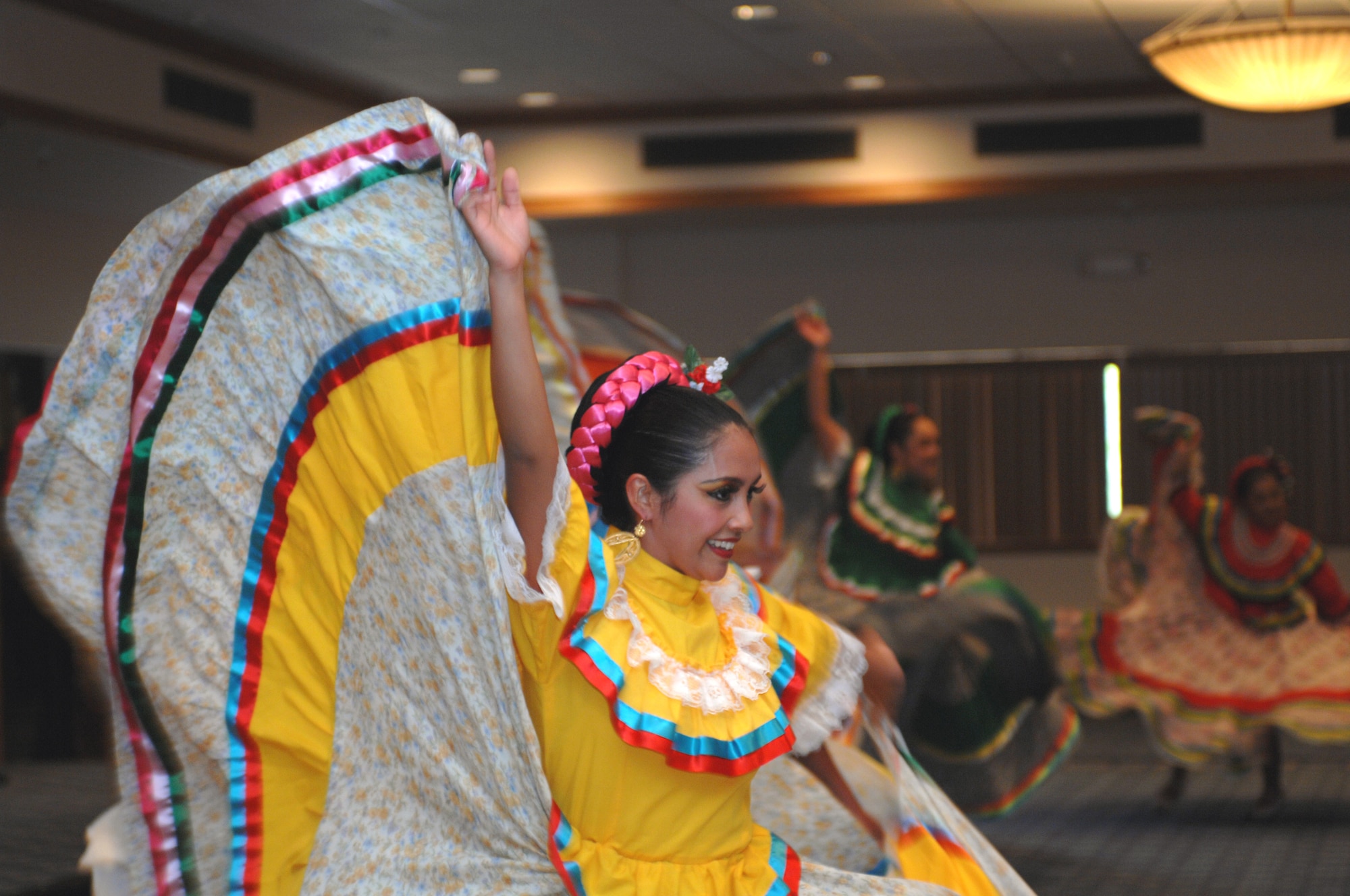 Ballet Folklorico Quetzales dancers from El Paso, Texas, perform a dance routine for the Hispanic Heritage Luncheon at the enlisted club, at Holloman Air Force Base, N.M., September 25. The dresses and style of step dance represent the region of Jalisco, Mexico. (U.S. Air Force photo/Airman 1st Class Veronica Salgado)   