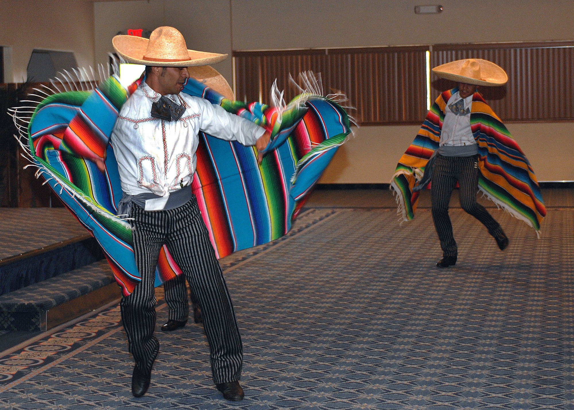 Ballet Folklorico Quetzales dancers step to the beat of Mexican music for the Hispanic Heritage Luncheon, at Holloman Air Force Base, N.M., September 25. Dressed in sombreros and covered with their Serape Mexican blankets, the dancers entertained their guests with their heel-stomping routine. (U.S. Air Force photo/Airman 1st. Class Veronica Salgado)