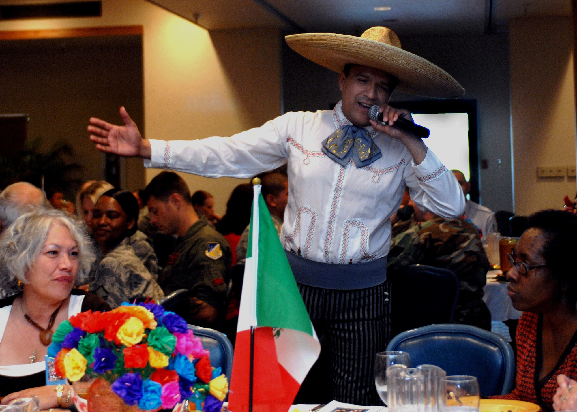 Jaime Carrasco, director of the Ballet Folklorico Quetzeles dancers, sings Cielito Lindo to all the guests who attended the Hispanic Heritage Luncheon at Holloman Air Force Base, N.M., September 25. Singer Carrasco, shows off his vocal skills with melodies inspired by Mexican music. (U.S. Air Force photo/Airman 1st. Class Veronica Salgado)