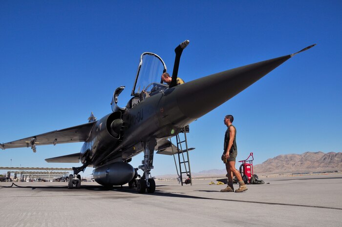 NELLIS AIR FORCE BASE, Nev. -- French Air Force airmen prepare their Mirage F1 for a Green Flag mission from Nellis AFB.  Green Flag exercises provide realistic close air support training focusing on air support for high desert armored warfare.  Green Flag also trains Air Force and coalition ground combat units in the tactical control of airpower.  (U.S. Air Force photo by Chief Master Sgt. Gary Emery)