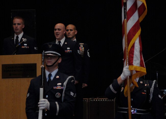Staff Sgt. Sam Hymas and Senior Airman Kris Butler sing the national anthem at the annual Air Force Ball held at the North Charleston Convention Center Sept. 27. More than 850 Team Charleston members came together to celebrate the Air Force's 61st birthday. Sergeant Hymas is the NCOIC of Civic Outreach with the 437th Airlift Wing Public Affairs office Airman Butler is a flying crew chief with the 437th Maintenance Squadron. (U.S. Air Force photo/Airman 1st Class Katie Gieratz)