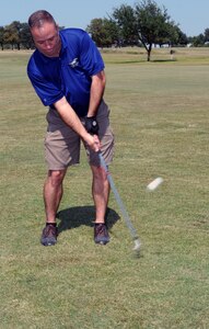 Chief Master Sgt. Stephen Page, 12th Flying Training Wing command chief master sergeant,tees off at his farewell golf tournament Oct. 1 at Randolph Oaks Golf Course. This chief retires Oct. 3. (U.S. Air Force photo by Rich McFadden)