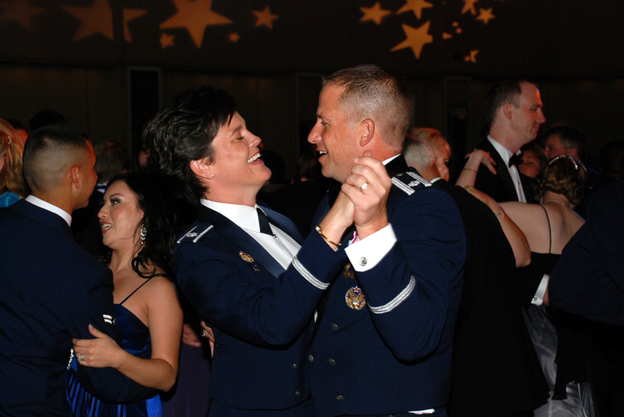 Lt. Col. Jeanette Voigt, 32nd Air Refueling Squadron commander, and her husband Lt. Col. Kyle Voigt, 818th Global Mobility Squadron commander, enjoy time together during McGuire’s Air Force Ball Sept. 26 at the Trump Plaza in Atlantic City, N.J. Airmen and their guests enjoyed music, by the U.S. Air Force Strolling Strings, and dinner, complete with an Air Force Ball birthday cake, and celebrated 61 years of Air Force history. (U.S. Air Force photo/Capt. Darrick Lee)