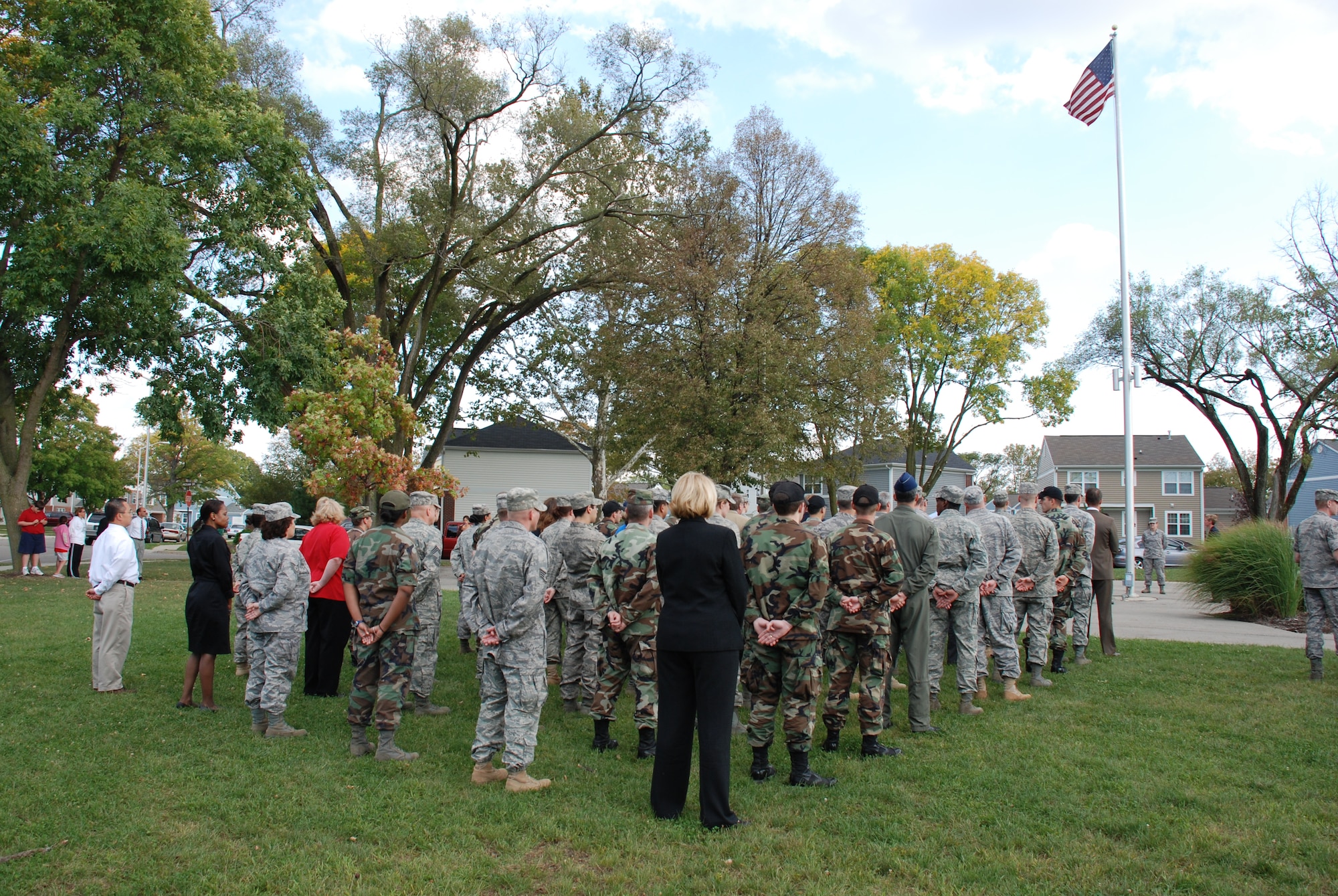 More than sixty Air Force Research Laboratory military and civilian personnel paid tribute to their deployed colleagues Sept. 30 by conducting a flag retreat ceremony at The Prairies at Wright Field military housing on Colonel Glenn Highway. (U.S. Air Force photo/Chris Gulliford)