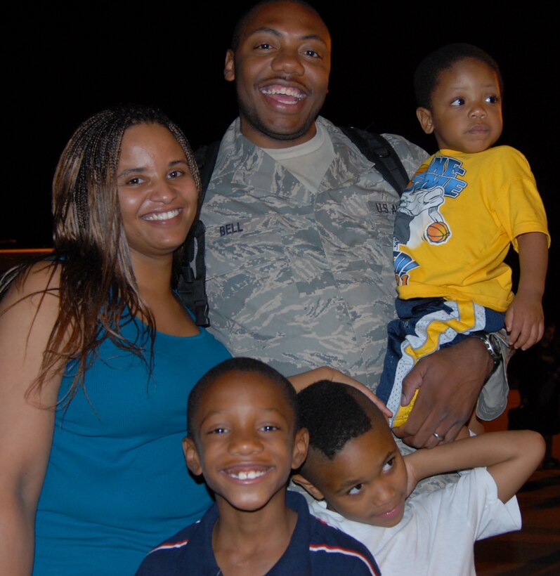 Staff Sgt. Kristopher Bell, 932nd Airlift Wing Aeromedical Staging Squadron biomedical equipment repairmen, reunites with his family after a deployment to Balad, Iraq Sept. 22. Several Reservists were greeted with balloons, flags and “welcome home” signs as they arrived on a new C-40. 

(U.S. Air Force photo/Courtesy photo )
