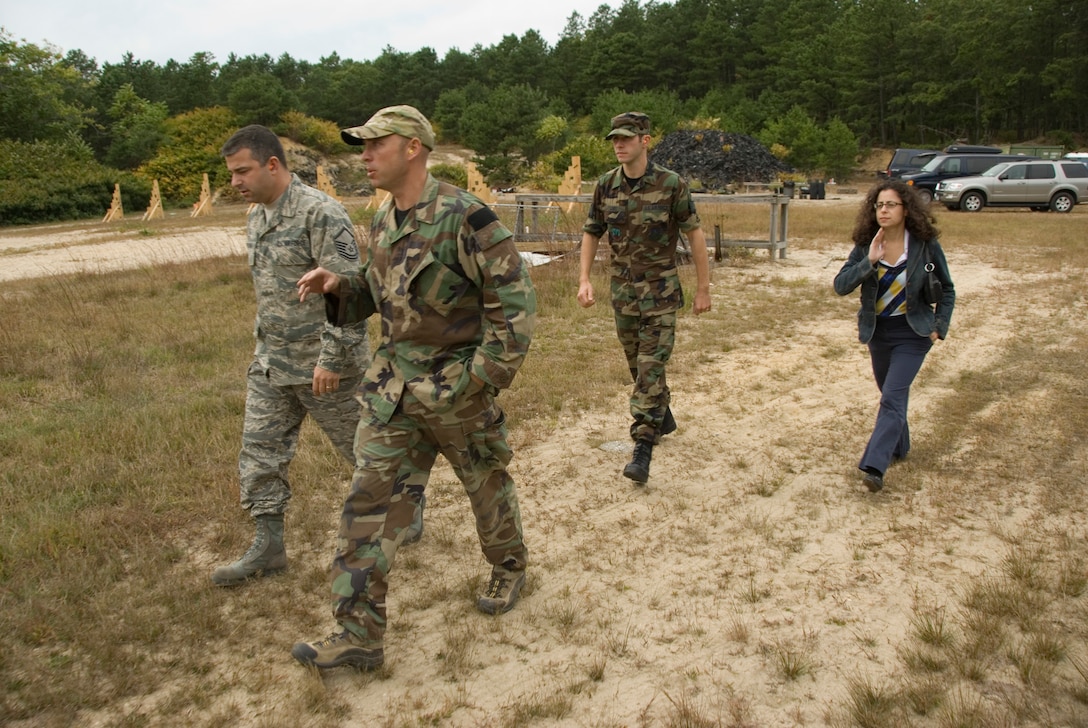 Calverton, N.Y. - 

Maj. John D. McElroy, 103rd Rescue Squadron, guides the advertising group around the rifle range where the Pararescuemen are firing.

A team from Air Guard Advertising came down to the 106th Rescue Wing on September 25, 2008, to take photos of the Pararescue Jumpers as part of a nationwide ad campaign for the Air National Guard. The team is made up of Air National Guard photographer Master Sgt. Robert Trubia, his assistant, videographer Tech Sgt. Don Luby, and their Producer and Studio Manager Venessa Scrivano. Master Sgt. Trubia and Tech Sgt. Luby are from the 158th Fighter Wing located in Vermont and have already traveled to many different units in the Air National Guard and plan to visit many more as part of an overarching advertising campaign. The first use of these photographs will be for a 2009 calendar.

(Official USAF photo by Staff Sgt. David J. Murphy)