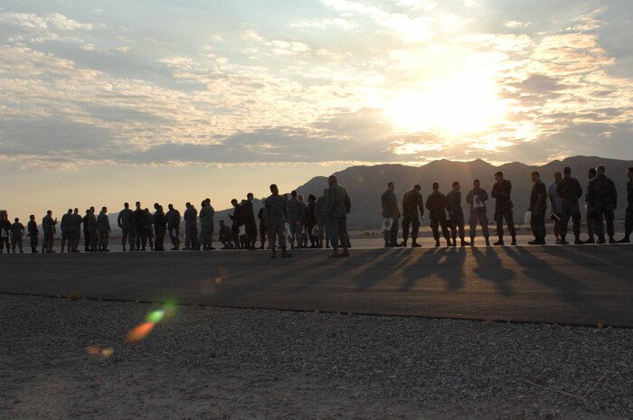 NELLIS AIR FORCE BASE, Nev. -- Airmen assigned to the 57th Wing prepare to walk the base runway in search of foreign object debris (FOD) that could potentially damage Air Force aircraft assets, on Sept. 30, 2008. (U.S. Air Force Photo by/Senior Airman Larry E. Reid Jr.)