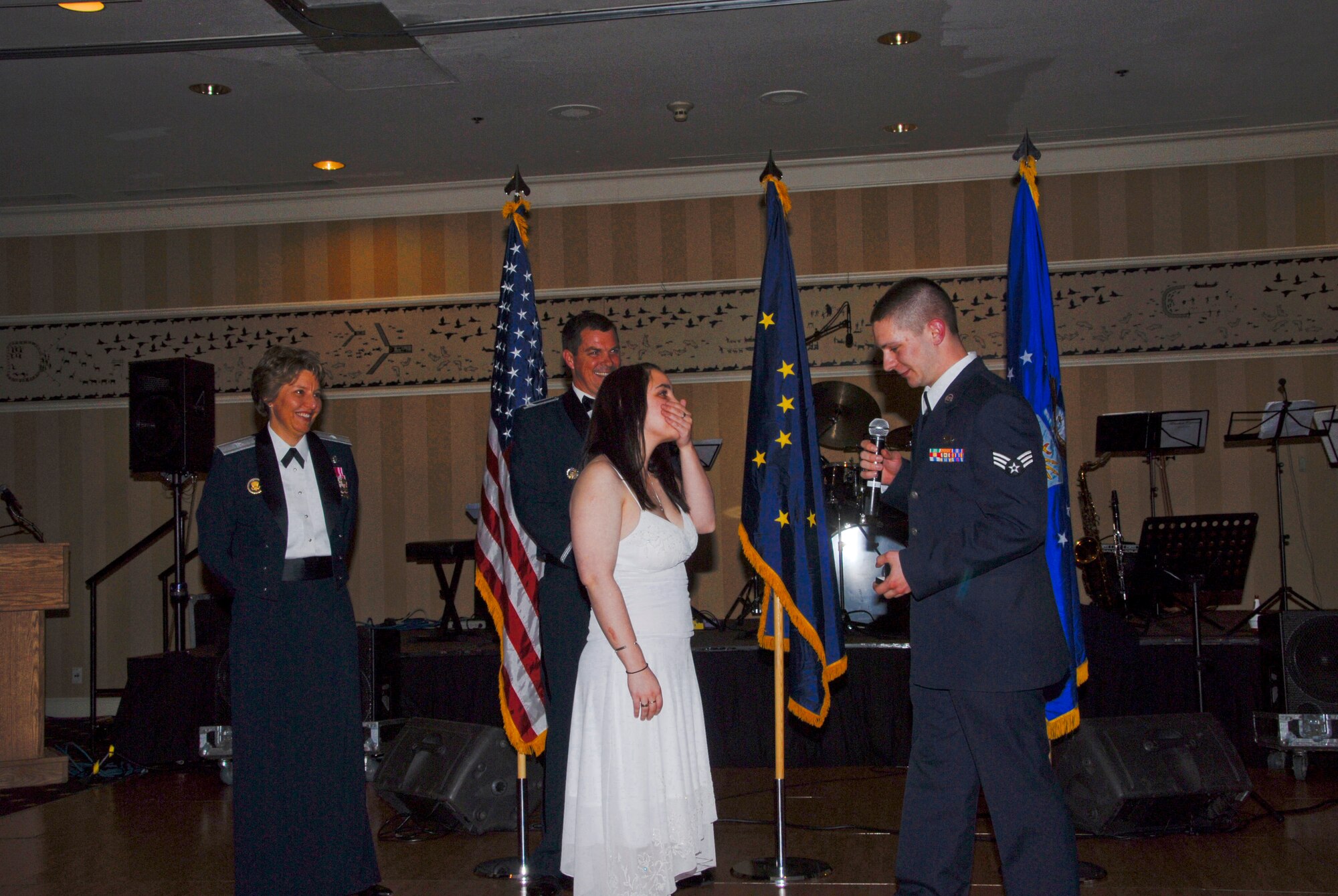ELMENDORF AIR FORCE BASE, Alaska -- Brig. Gen. Michelle Johnson, Deputy Director for Global Effects and the War on Terrorism for the Joint Staff, and Col. Richard Walberg, 3rd Wing vice commander, look on as Senior Airman Raymond Leighton, 3rd Component Maintenance Squadron, proposes to Chelsea King at a celebration marking the 61st birthday of the U.S. Air Force. (U.S. Air Force photo/Tech Sgt. Jeremiah Erickson)