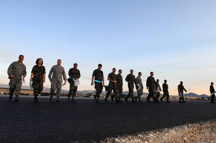 NELLIS AIR FORCE BASE, Nev. -- Airmen assigned to the 57th Wing prepare to walk the base runway in search of foreign object debris (FOD) that could potentially damage Air Force aircraft assets, on Sept. 30, 2008. (U.S. Air Force Photo by/Senior Airman Larry E. Reid Jr.)