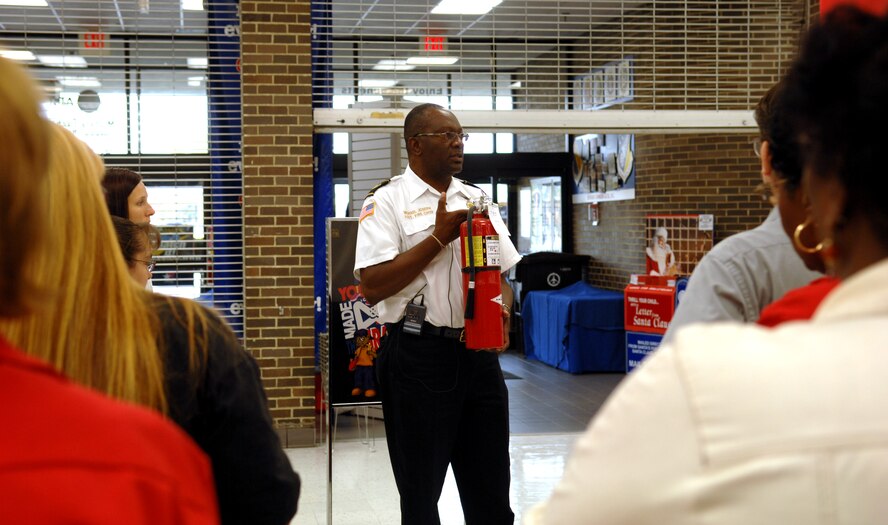eam Seymour?s Base Exchange employees participate in Fire Prevention Week by having a practice fire drill and fire extinguisher training. This year?s fire prevention theme is the prevention of home fires. [U.S. Air Force photo by Airman 1st Class Rae Henline]