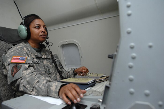 NELLIS AIR FORCE BASE, Nev. -- Army Staff Sgt. Paula Authorlee, an airborne target surveillance supervisor assigned to the 116th Air Control Wing, Robins Air Force Base, Ga., communicates with ground forces during a flying mission in support of Green Flag West on Sept. 25, 2008. Members of the 116th ACW, operating the E-8C Joint Surveillance Target Attack Radar System, provide long-range, air-to-ground surveillance designed to locate, classify and track ground targets for the Army and Marine Corps. (U.S. Air Force Photo/Senior Airman Larry E. Reid Jr.)